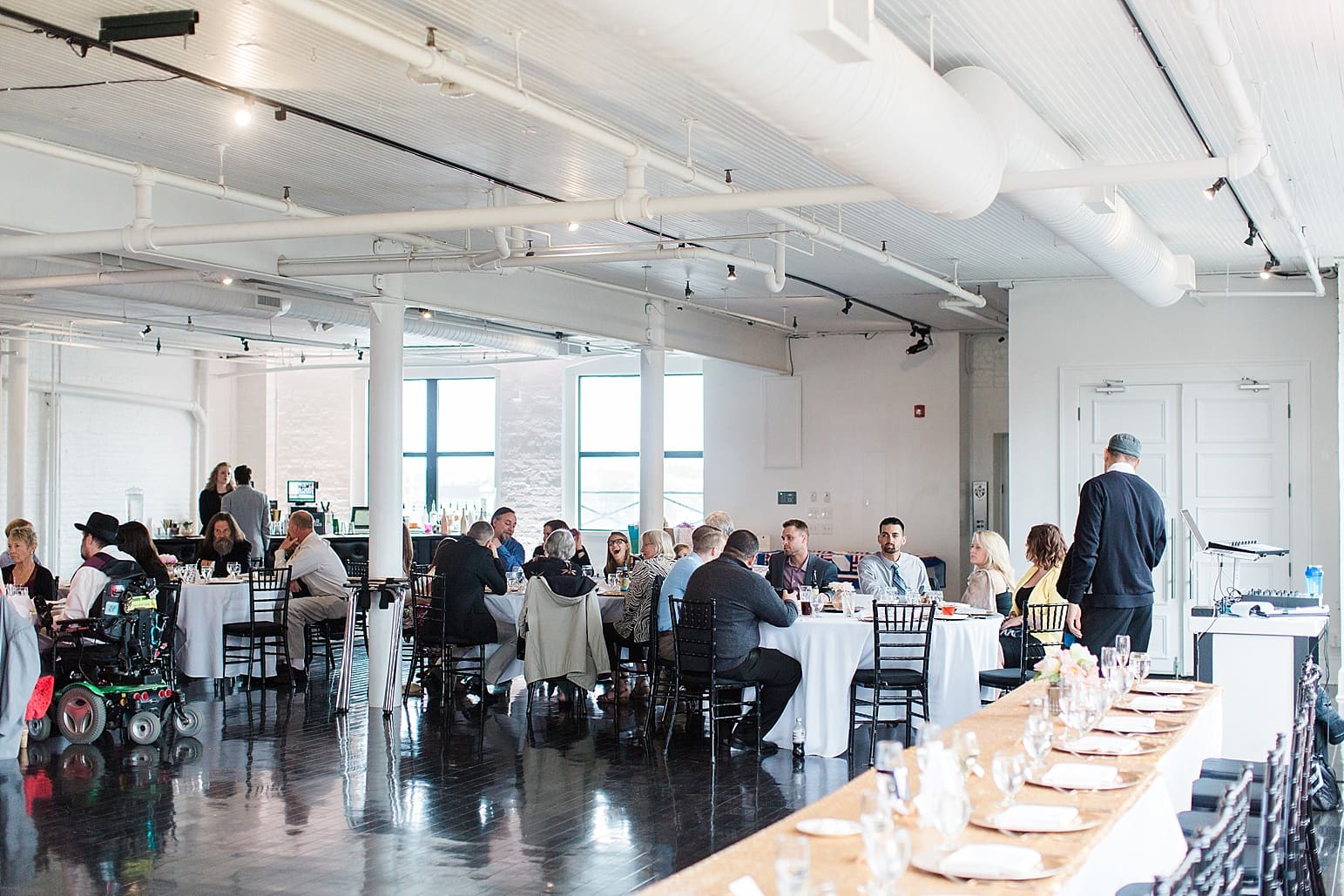Arielle Peters Photography | Wedding reception table settings and floral arrangements on wedding day at Loft 310 in Kalamazoo, Michigan.