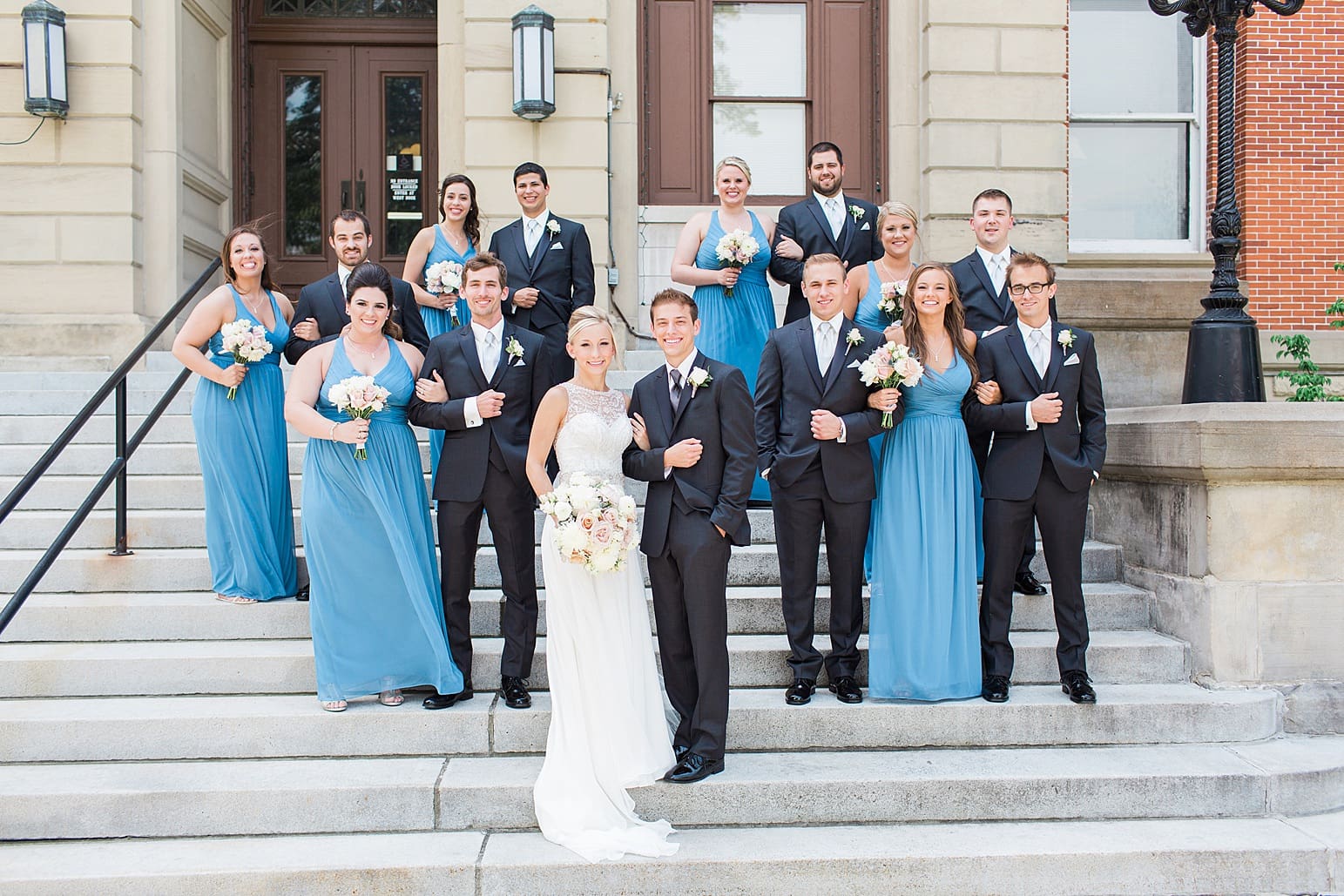 Arielle Peters Photography | Wedding party standing on church steps on wedding day at the Spohn Ballroom in Goshen, Indiana.
