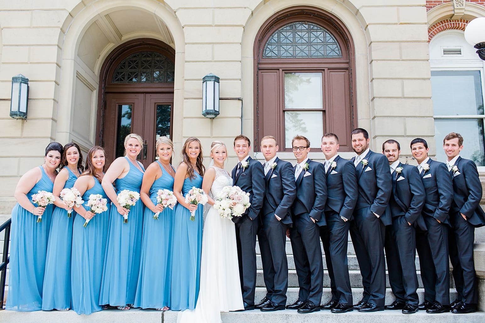 Arielle Peters Photography | Wedding party standing on church steps on wedding day at the Spohn Ballroom in Goshen, Indiana.