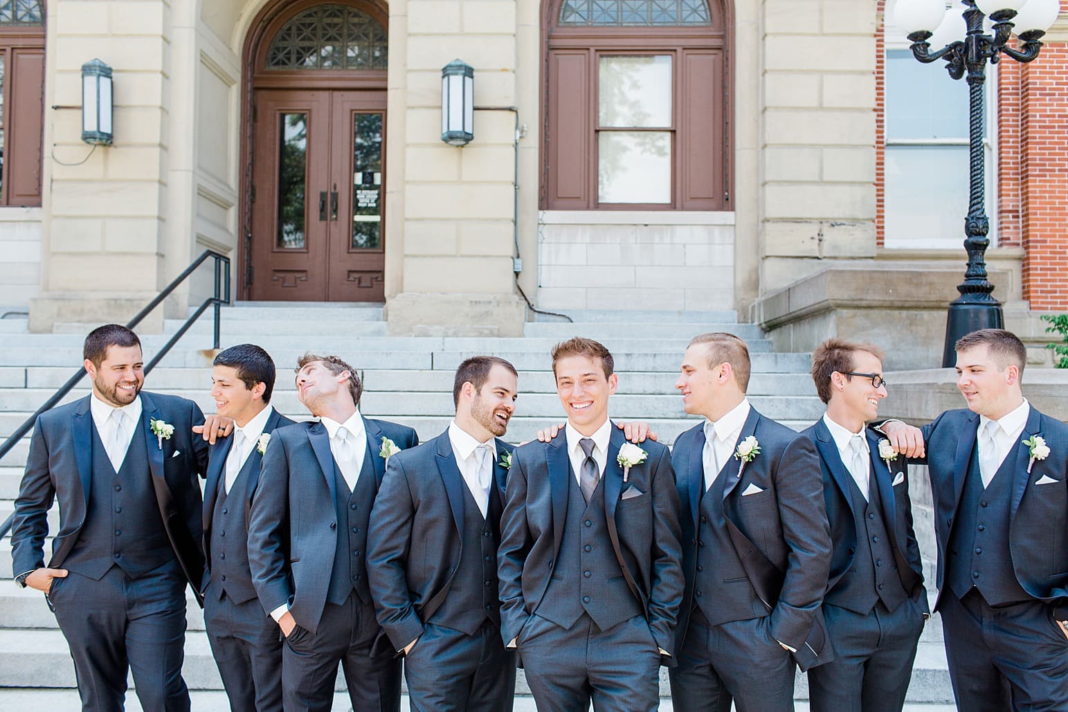 Arielle Peters Photography | Groom and groomsmen on church steps on wedding day at the Spohn Ballroom in Goshen, Indiana.