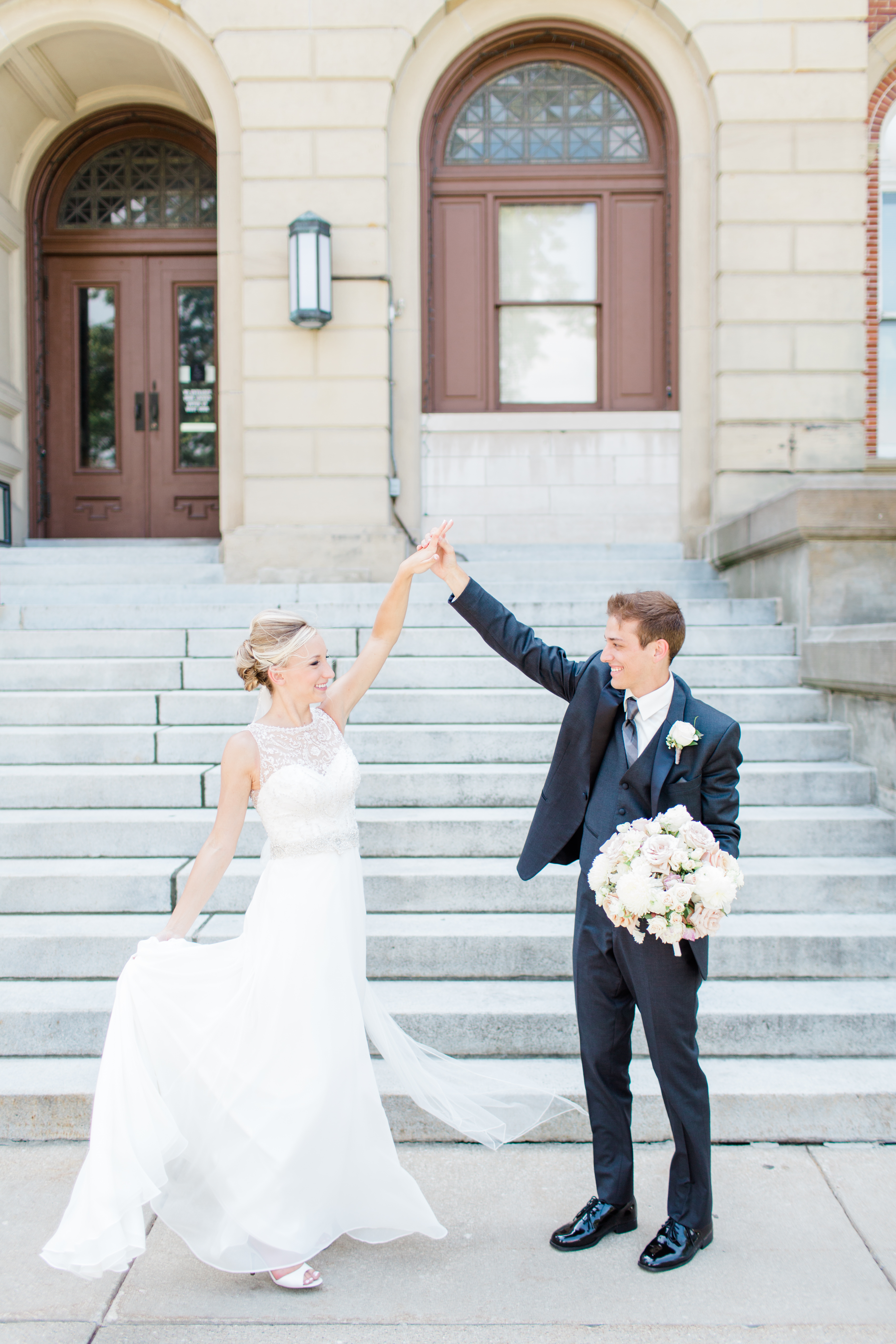 Arielle Peters Photography taking a couple’s wedding day photos at the Spohn Ballroom in Goshen, Indiana.