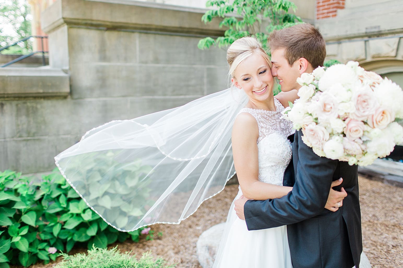 Arielle Peters Photography | Bride and groom in church garden on wedding day at the Spohn Ballroom in Goshen, Indiana.