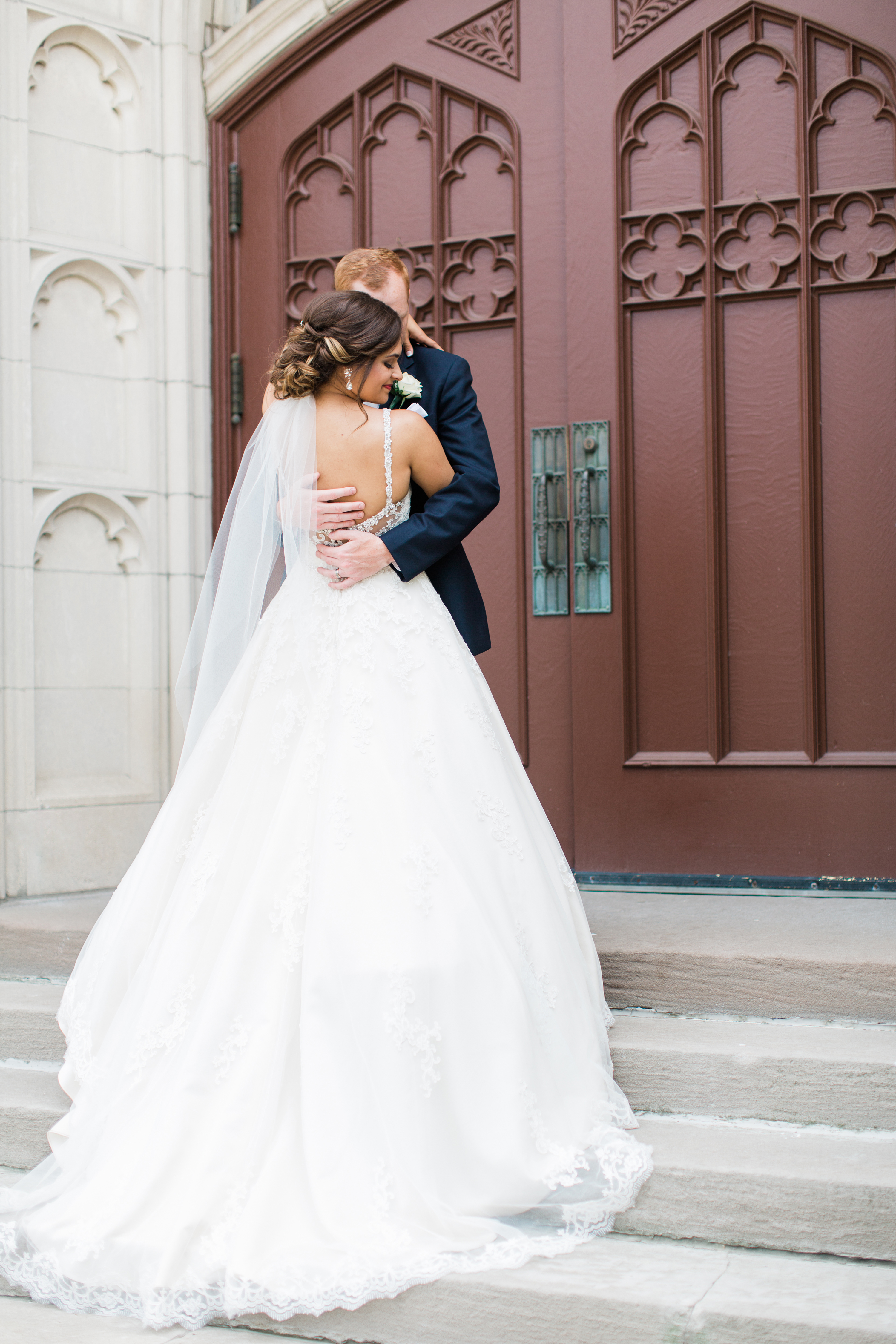 Arielle Peters Photography taking a couple’s wedding day photos at the Holiday Inn Conference Center in Mishawaka, Indiana.