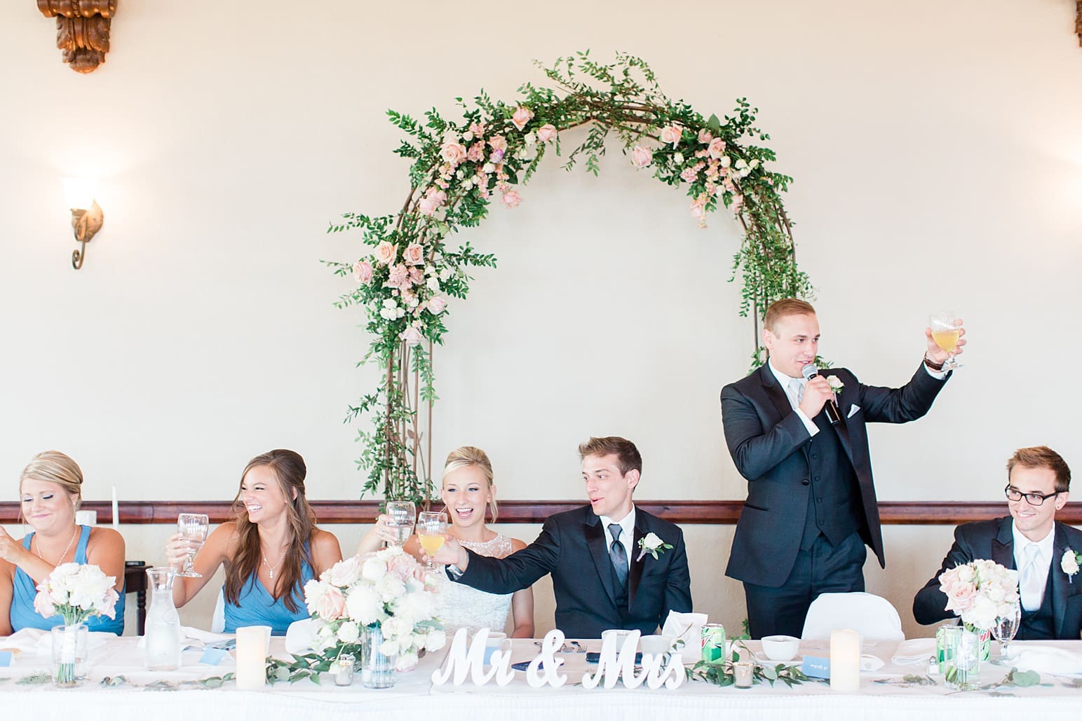 Arielle Peters Photography | Best man toasting at wedding reception on wedding day at the Spohn Ballroom in Goshen, Indiana.