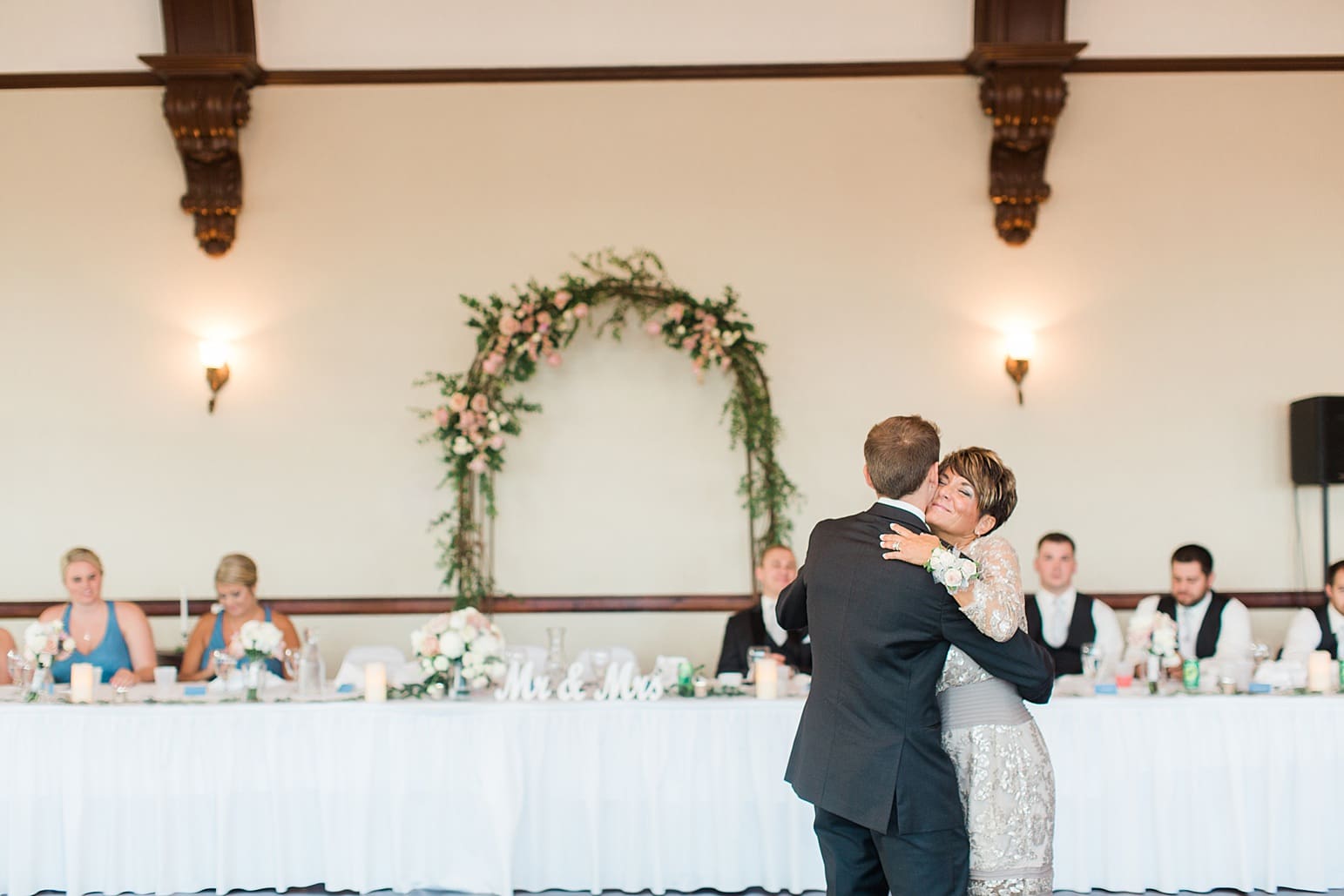 Arielle Peters Photography | Mother of groom and groom sharing a dance at wedding reception on wedding day at the Spohn Ballroom in Goshen, Indiana.