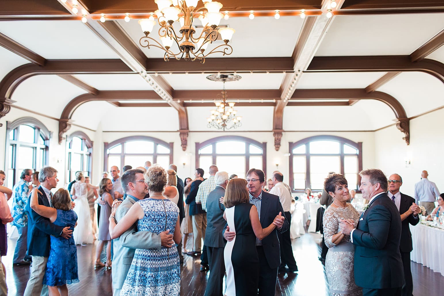 Arielle Peters Photography | Wedding guests slow dancing at wedding reception on wedding day at the Spohn Ballroom in Goshen, Indiana.