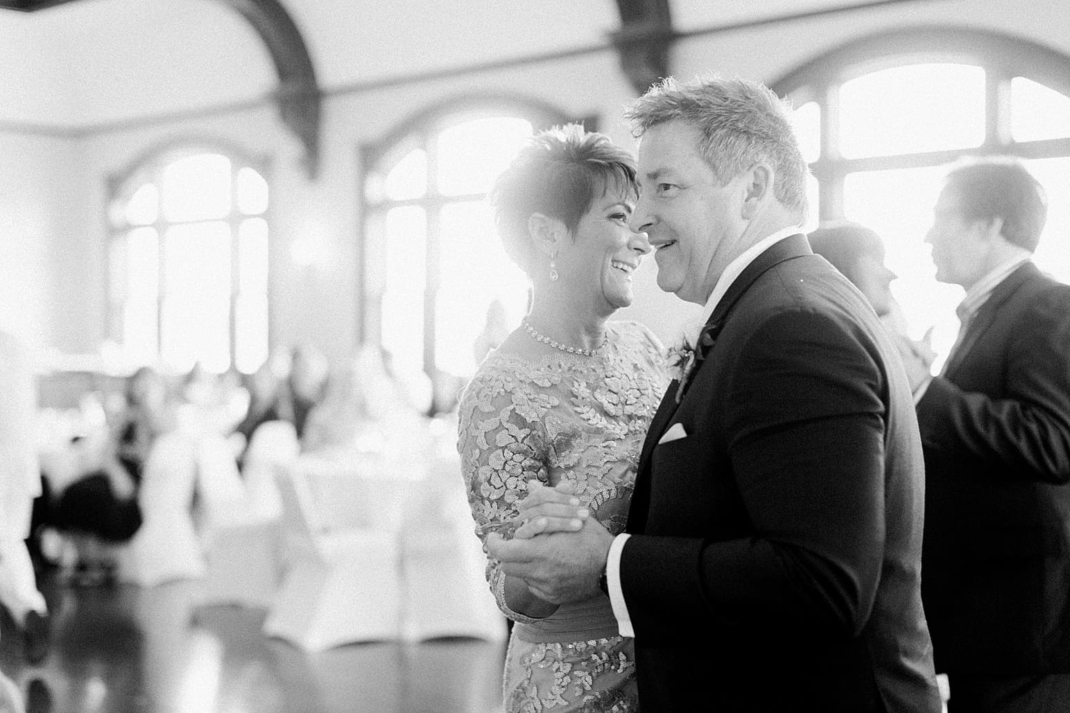 Arielle Peters Photography | Wedding guests slow dancing at wedding reception on wedding day at the Spohn Ballroom in Goshen, Indiana.