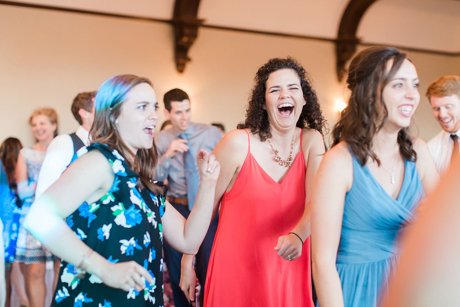 Arielle Peters Photography | Wedding guests dancing at wedding reception on wedding day at the Spohn Ballroom in Goshen, Indiana.