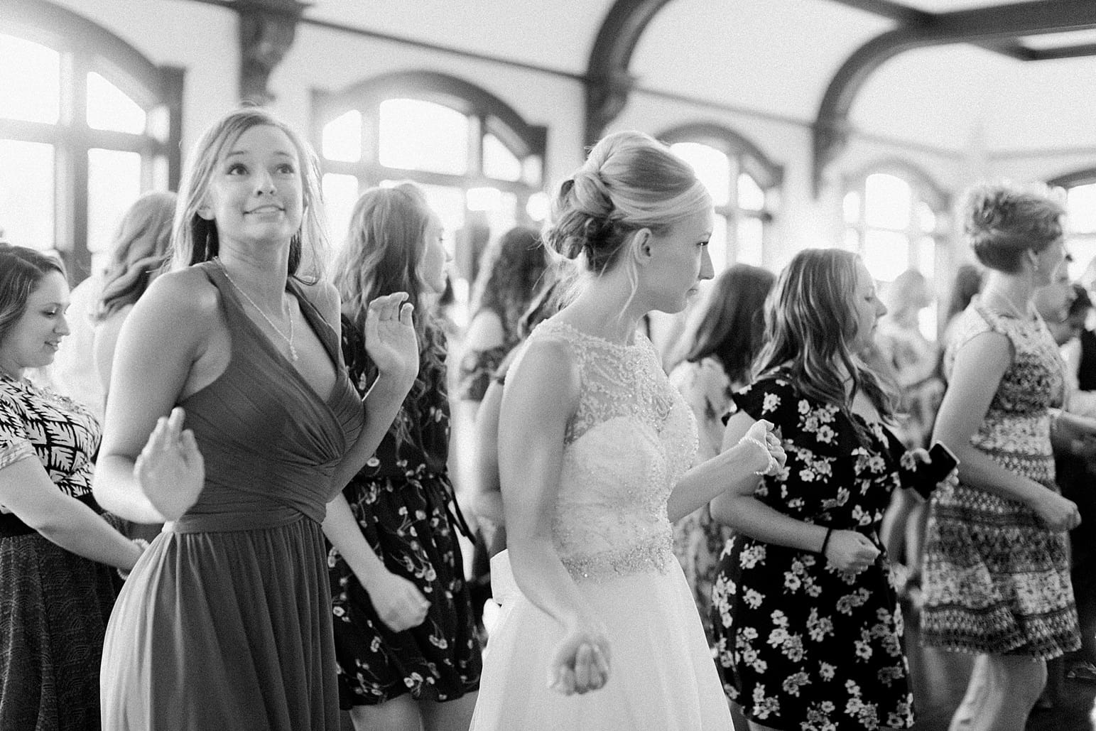 Arielle Peters Photography | Wedding guests dancing at wedding reception on wedding day at the Spohn Ballroom in Goshen, Indiana.