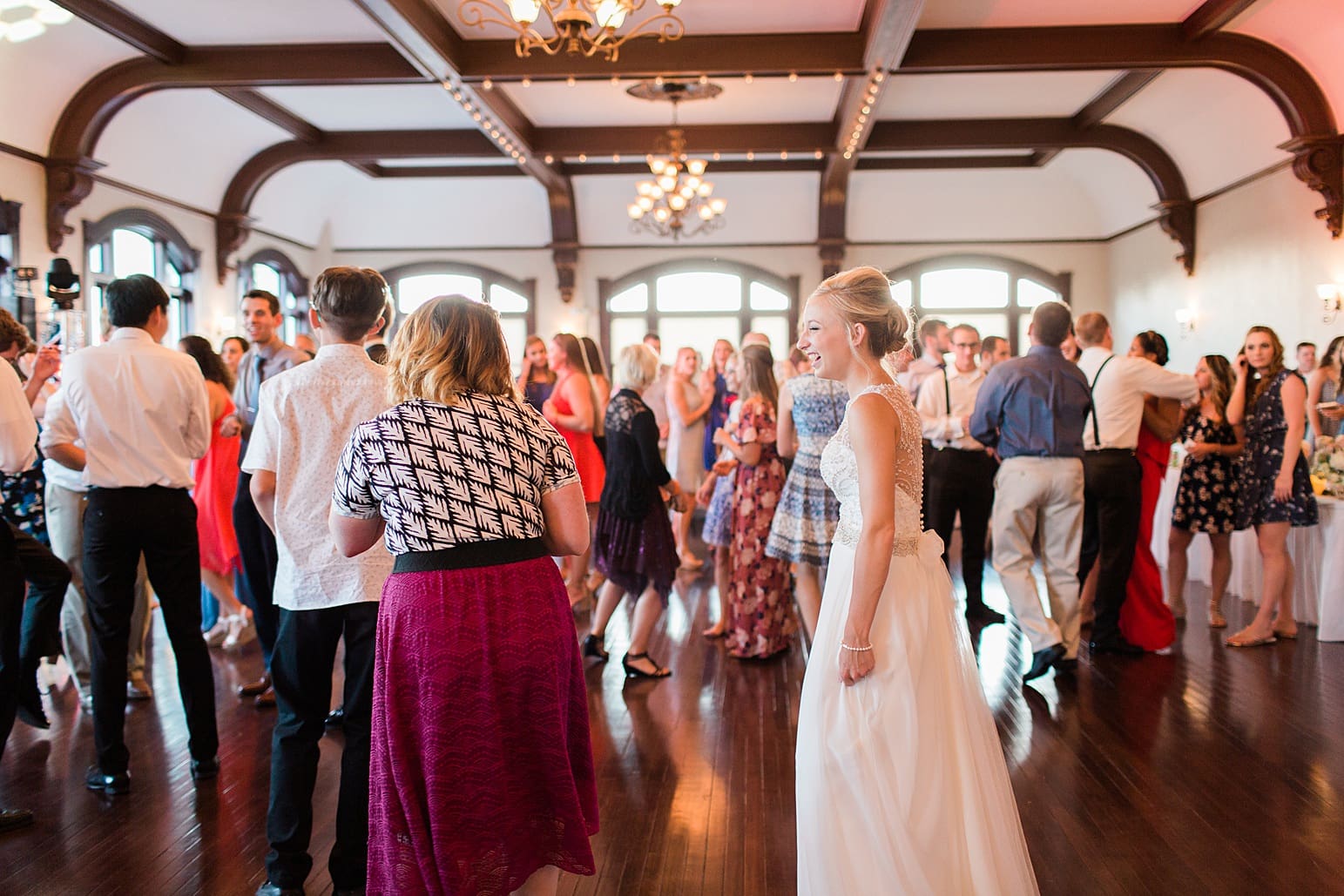 Arielle Peters Photography | Wedding guests dancing at wedding reception on wedding day at the Spohn Ballroom in Goshen, Indiana.