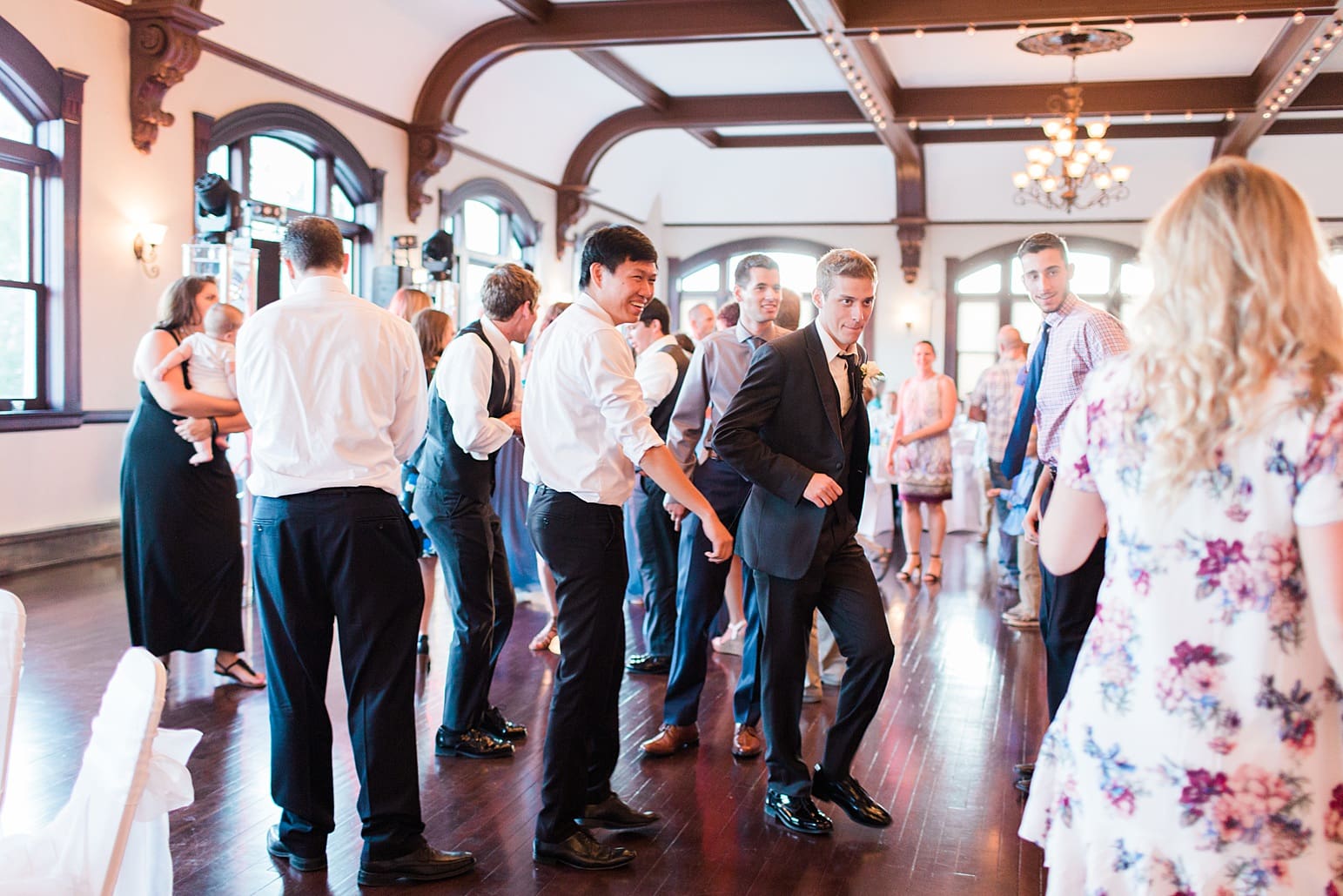 Arielle Peters Photography | Wedding guests dancing at wedding reception on wedding day at the Spohn Ballroom in Goshen, Indiana.
