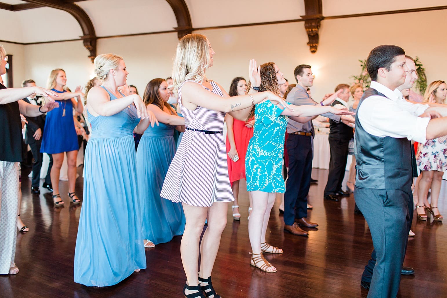 Arielle Peters Photography | Wedding guests dancing at wedding reception on wedding day at the Spohn Ballroom in Goshen, Indiana.