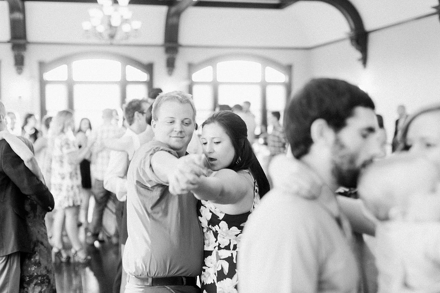 Arielle Peters Photography | Wedding guests dancing at wedding reception on wedding day at the Spohn Ballroom in Goshen, Indiana.