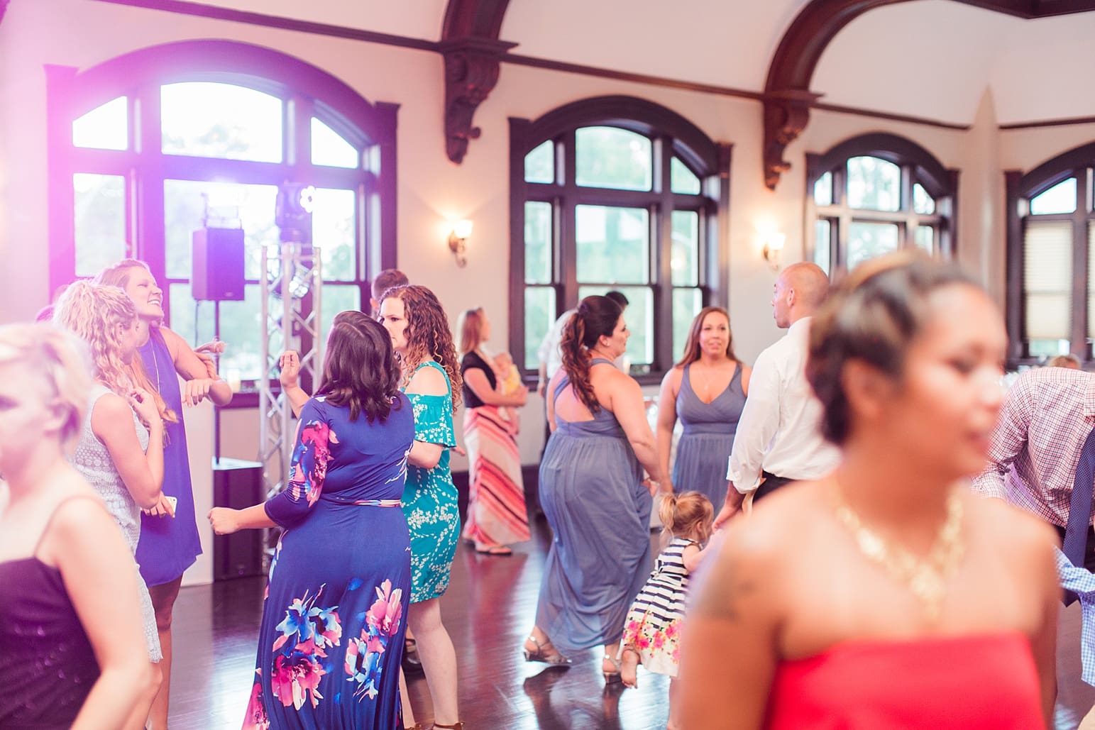 Arielle Peters Photography | Wedding guests dancing at wedding reception on wedding day at the Spohn Ballroom in Goshen, Indiana.