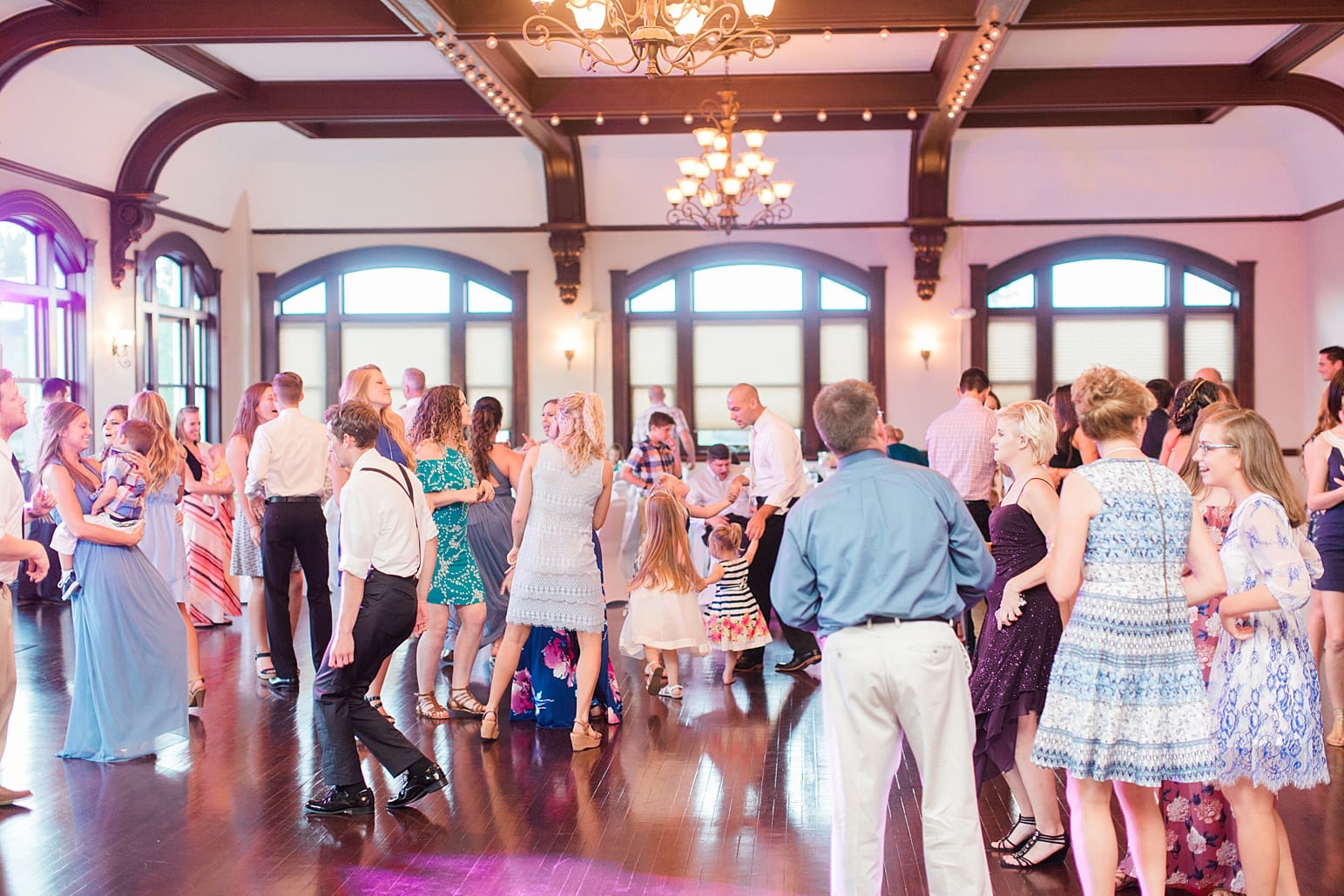 Arielle Peters Photography | Wedding guests dancing at wedding reception on wedding day at the Spohn Ballroom in Goshen, Indiana.