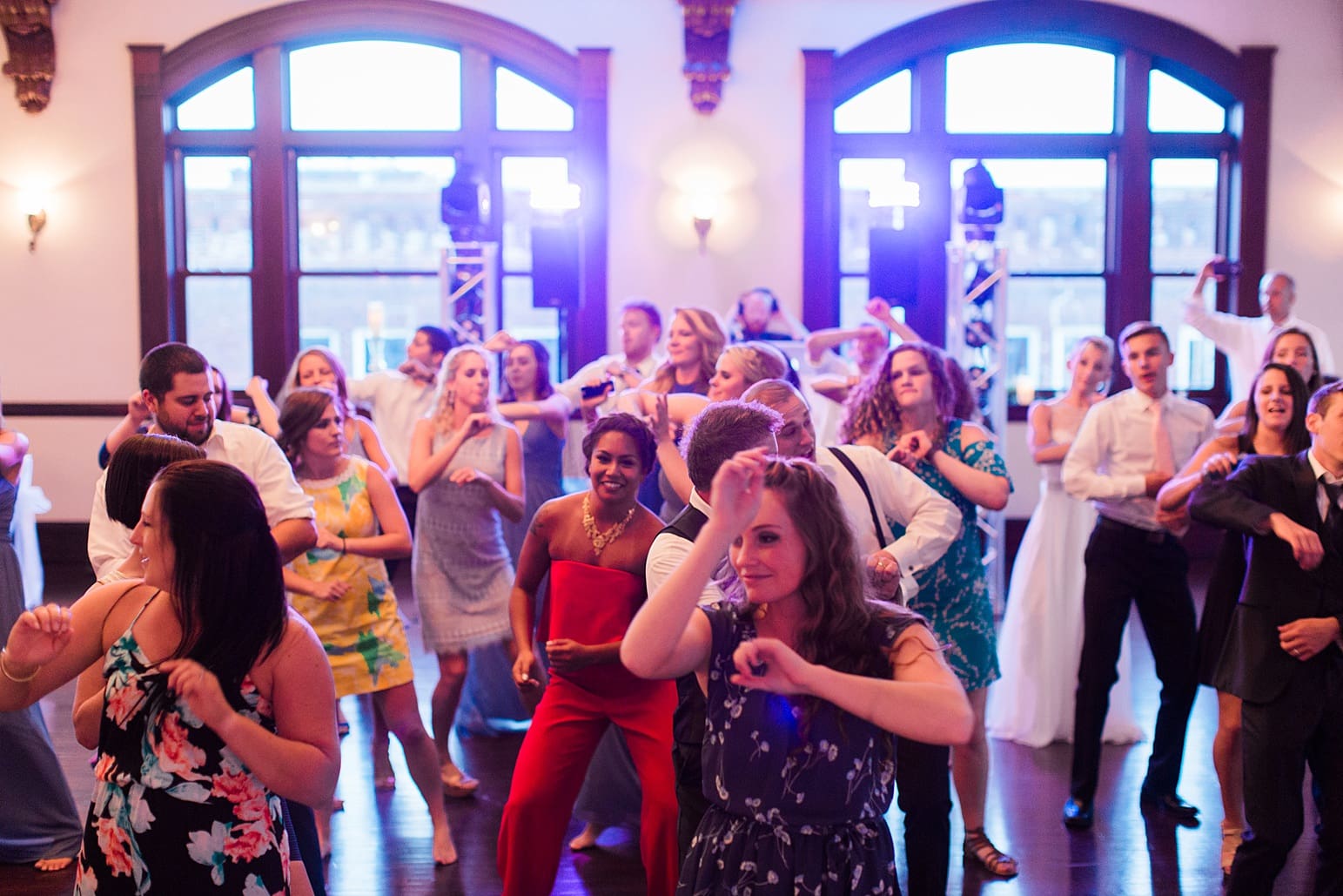 Arielle Peters Photography | Bride and groom dancing with guests at wedding reception on wedding day at the Spohn Ballroom in Goshen, Indiana.