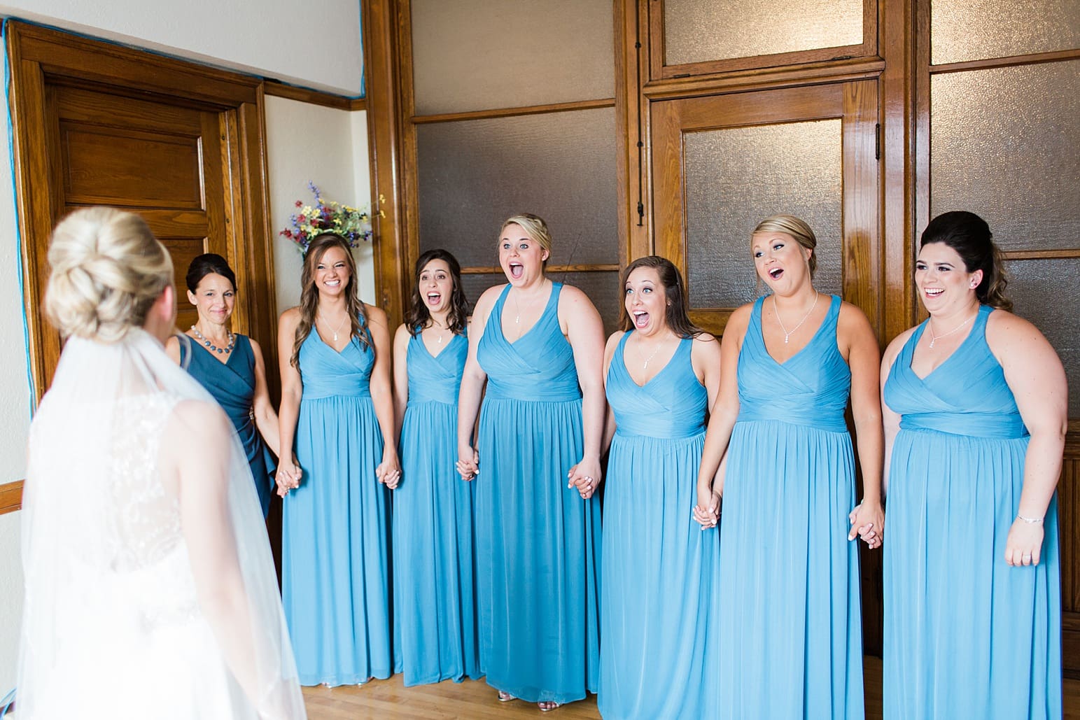 Arielle Peters Photography | Bride and bridesmaids having first reveal on wedding day at the Spohn Ballroom in Goshen, Indiana.