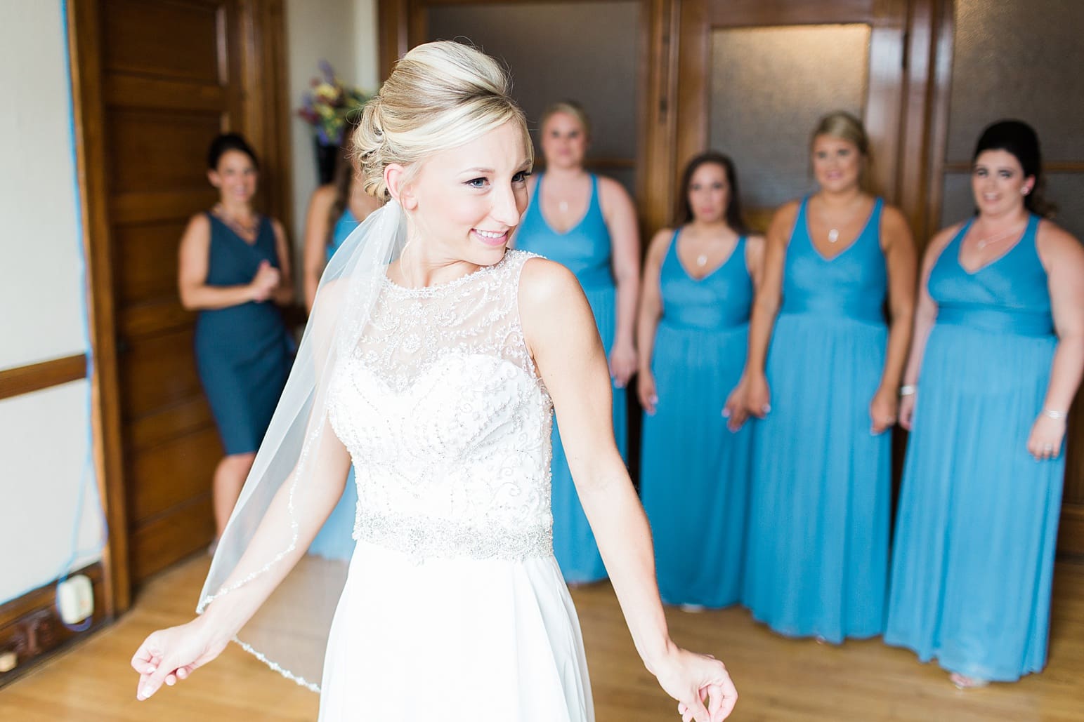 Arielle Peters Photography | Bride and bridesmaids having first reveal on wedding day at the Spohn Ballroom in Goshen, Indiana.