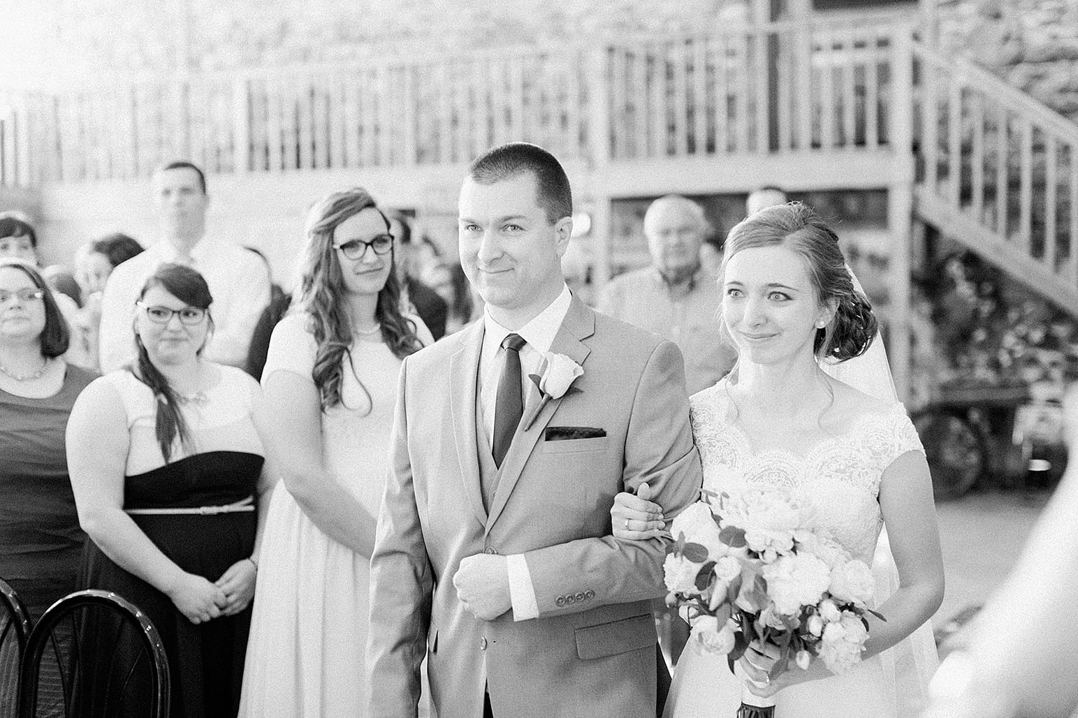 Arielle Peters Photography | Father of bride walking bride down the aisle on wedding day at Lawton Lions Heritage Community Center in Lawton, Michigan.