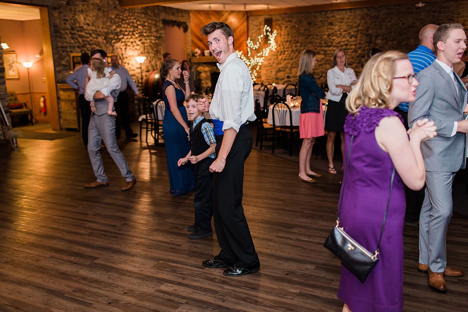 Arielle Peters Photography | Wedding guests dancing at wedding reception at Lawton Lions Heritage Community Center in Lawton, Michigan.