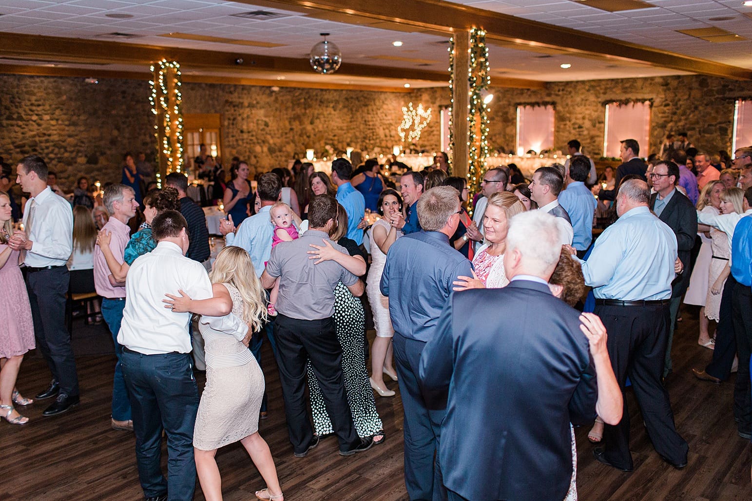 Arielle Peters Photography | Wedding guests dancing at wedding reception at Lawton Lions Heritage Community Center in Lawton, Michigan.