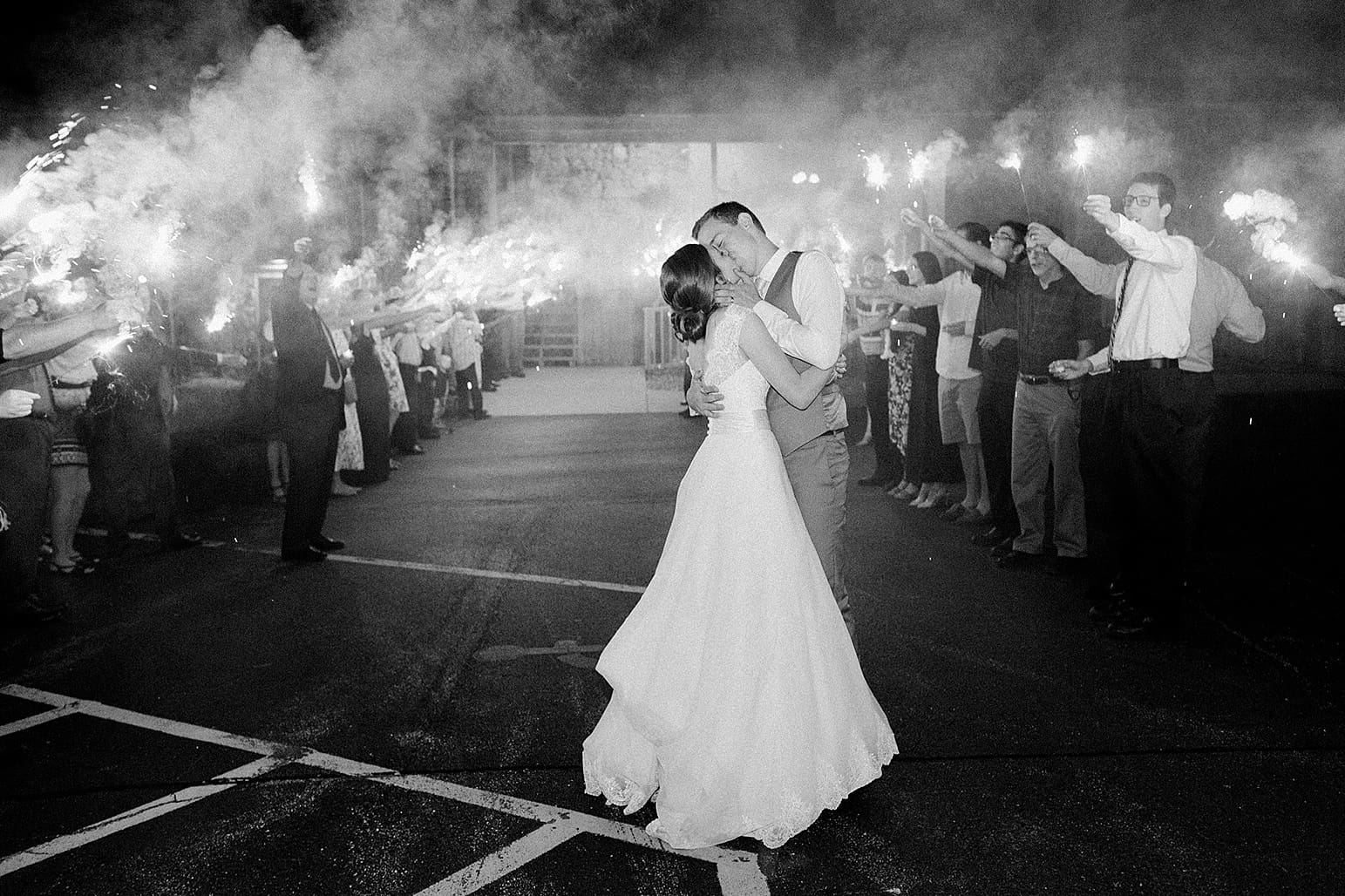 Arielle Peters Photography | Bride and groom kissing during sparkler sendoff at Lawton Lions Heritage Community Center in Lawton, Michigan.
