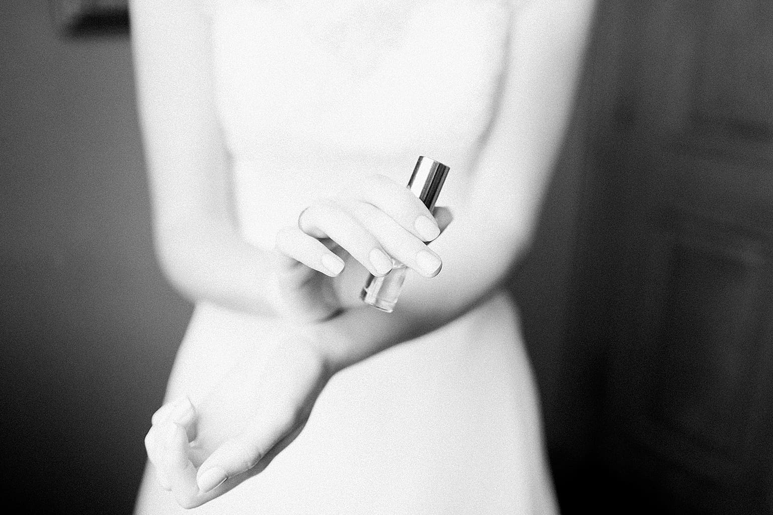 Arielle Peters Photography | Bride putting on perfume on wedding day at Lawton Lions Heritage Community Center in Lawton, Michigan.