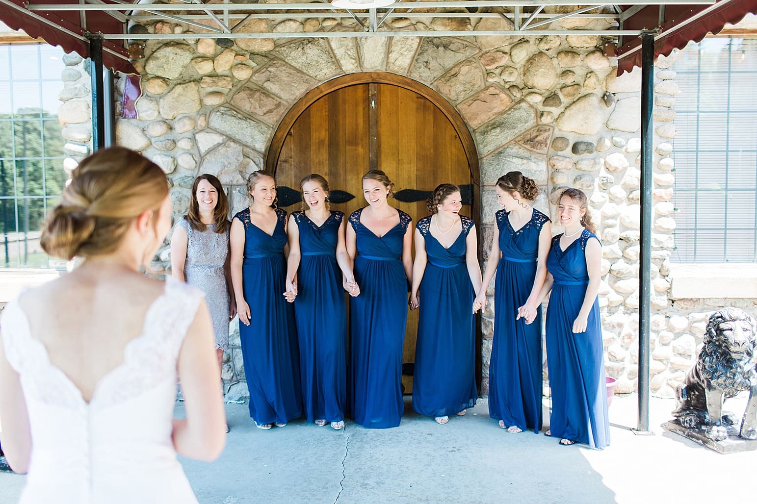 Arielle Peters Photography | Bride and bridesmaids having first reveal on wedding day at Lawton Lions Heritage Community Center in Lawton, Michigan.