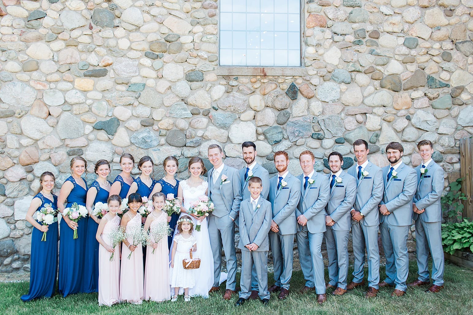 Arielle Peters Photography | Wedding party by historic cobblestone building on wedding day at Lawton Lions Heritage Community Center in Lawton, Michigan.