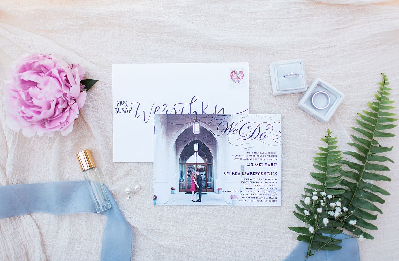 Arielle Peters Photography | Wedding invitation and jewelry on wedding day at Lawton Lions Heritage Community Center in Lawton, Michigan.