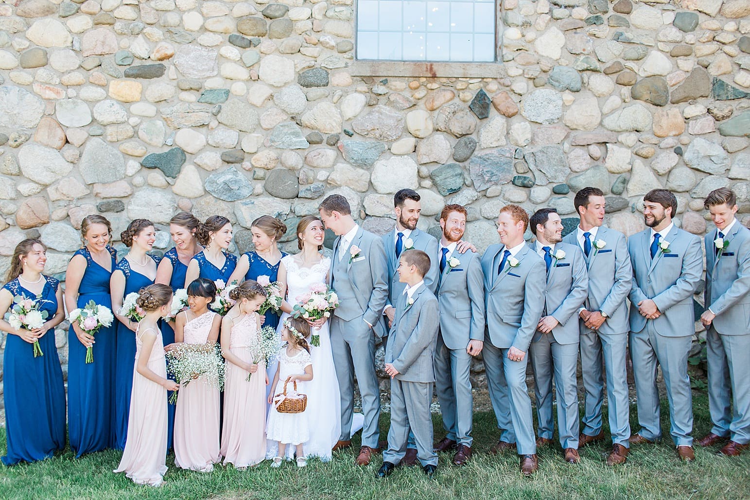 Arielle Peters Photography | Wedding party next to historic cobblestone building on wedding day at Lawton Lions Heritage Community Center in Lawton, Michigan.