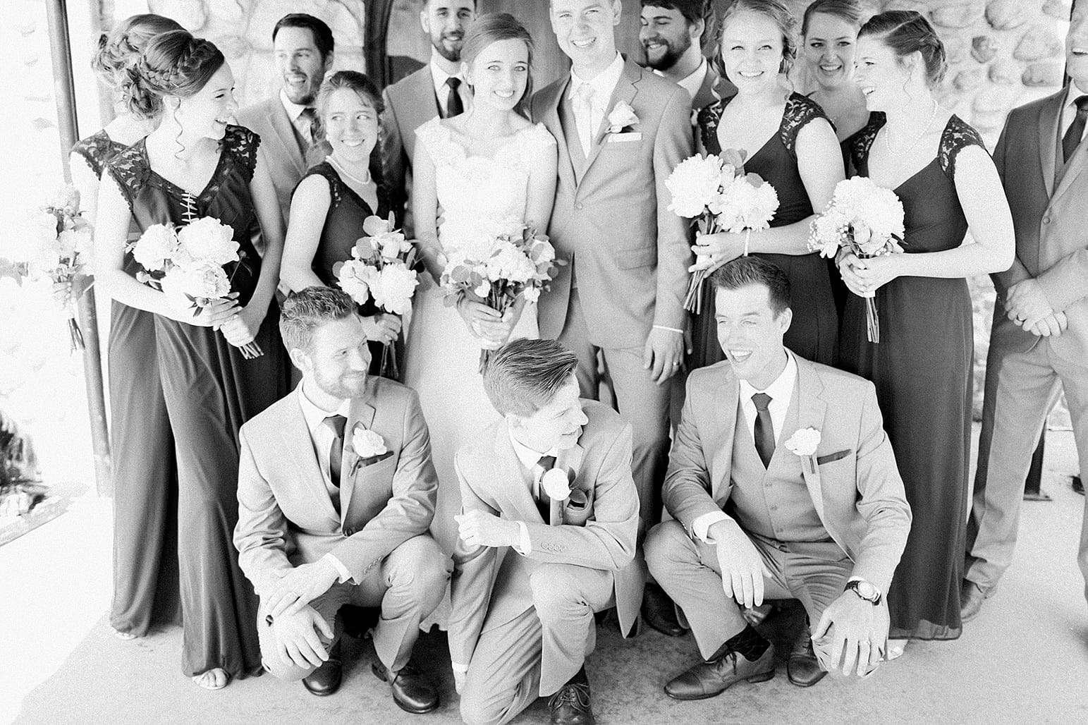 Arielle Peters Photography | Wedding party in front of wooden cellar door on wedding day at Lawton Lions Heritage Community Center in Lawton, Michigan.