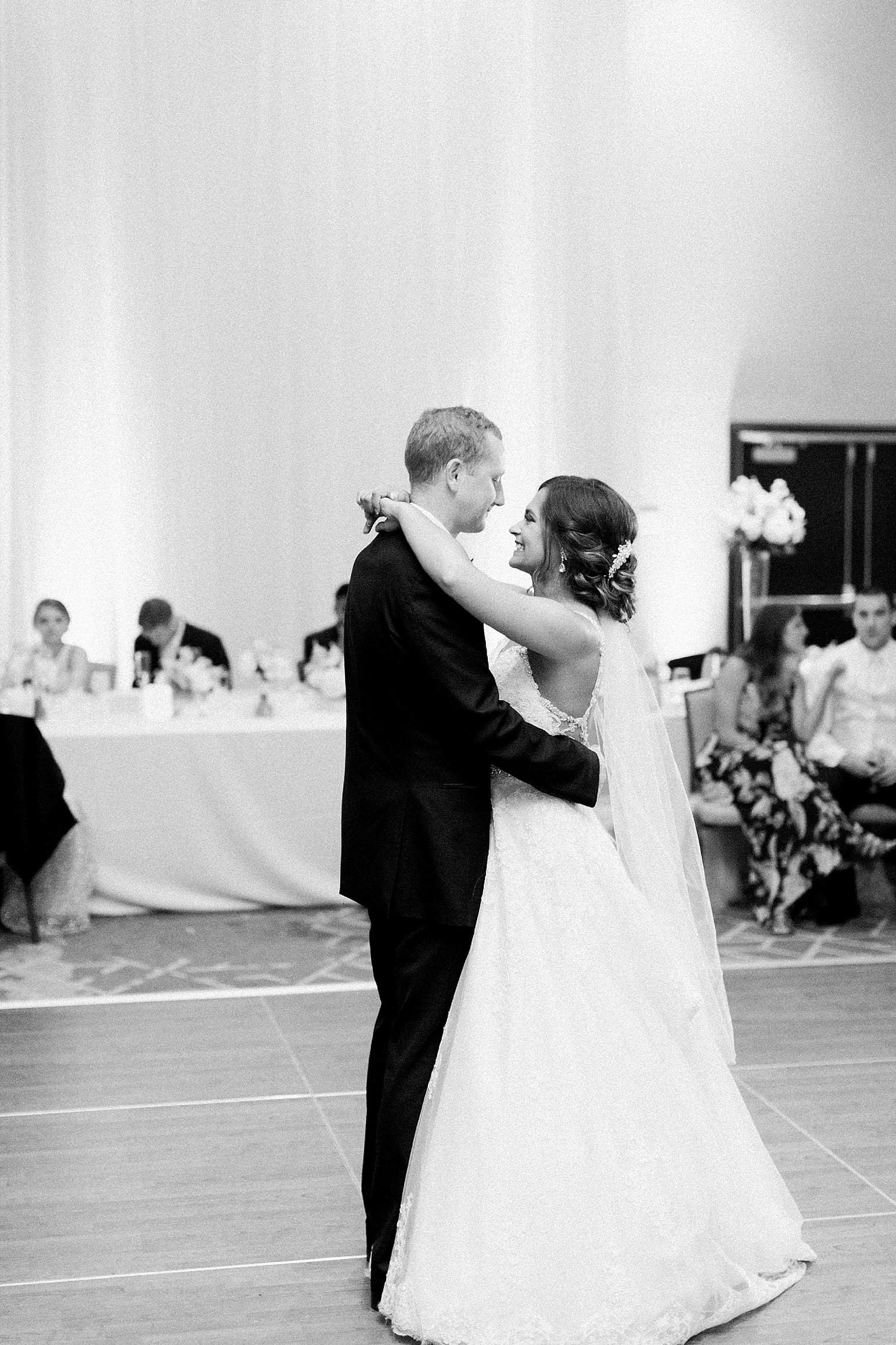 Arielle Peters Photography | Bride and groom sharing their first dance at wedding reception at the Holiday Inn in Mishawaka, Indiana.