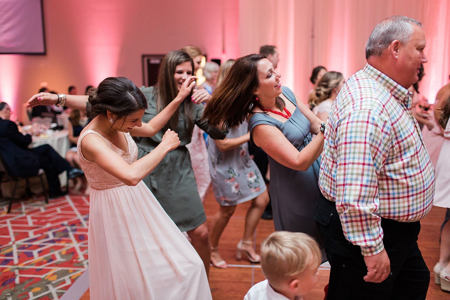Arielle Peters Photography | Wedding guests dancing at wedding reception at the Holiday Inn in Mishawaka, Indiana.