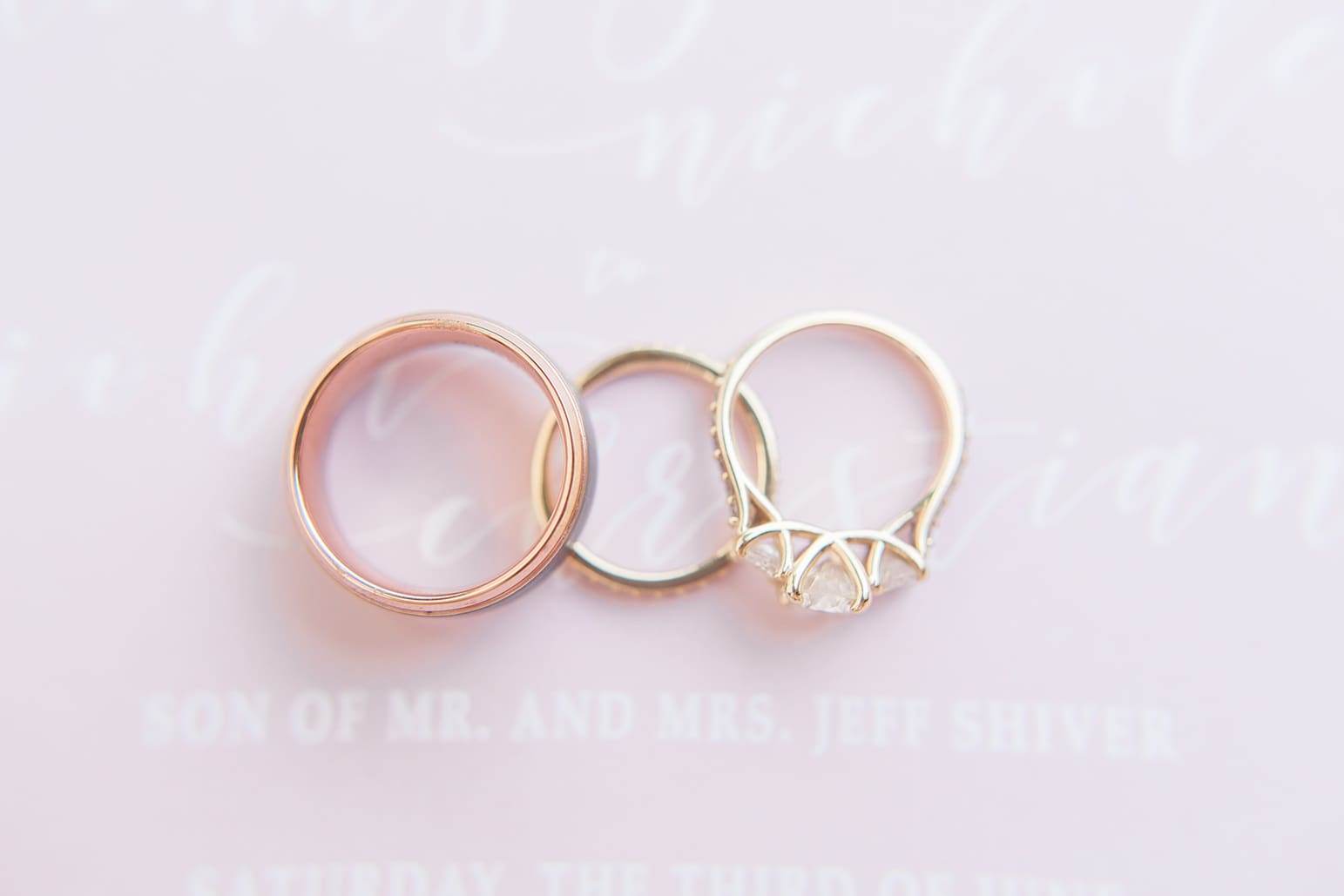 Arielle Peters Photography | Wedding rings lying on invitation on wedding day at First United Methodist Church in Mishawaka, Indiana.