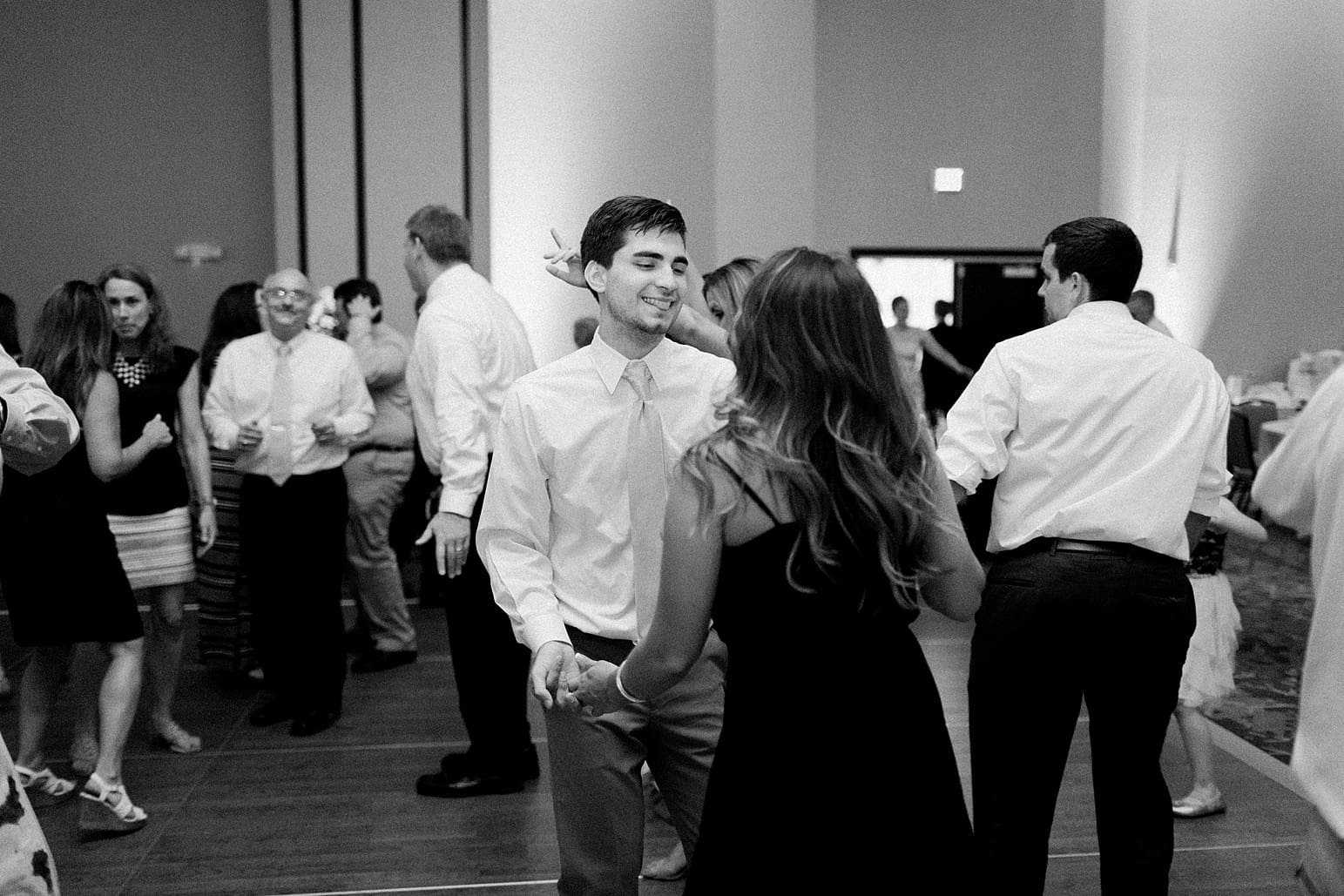 Arielle Peters Photography | Wedding guests dancing at wedding reception at the Holiday Inn in Mishawaka, Indiana.