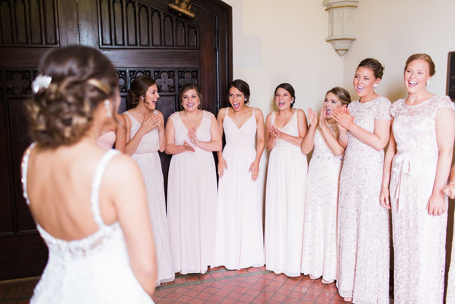 Arielle Peters Photography | Bride and bridesmaids having first reveal on wedding day at First United Methodist Church in Mishawaka, Indiana.