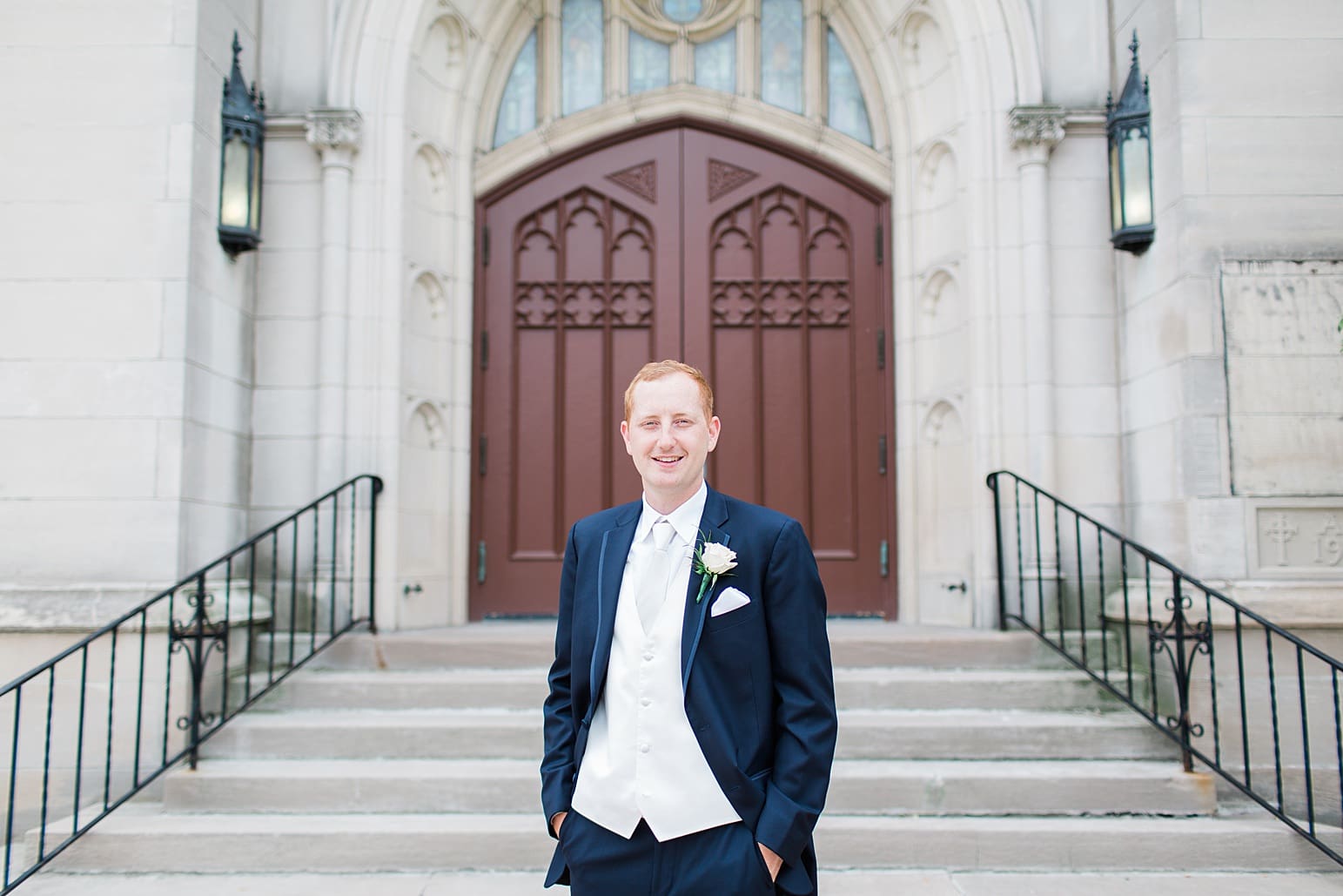 Arielle Peters Photography | Groom outside large cathedral church on wedding day at First United Methodist Church in Mishawaka, Indiana.