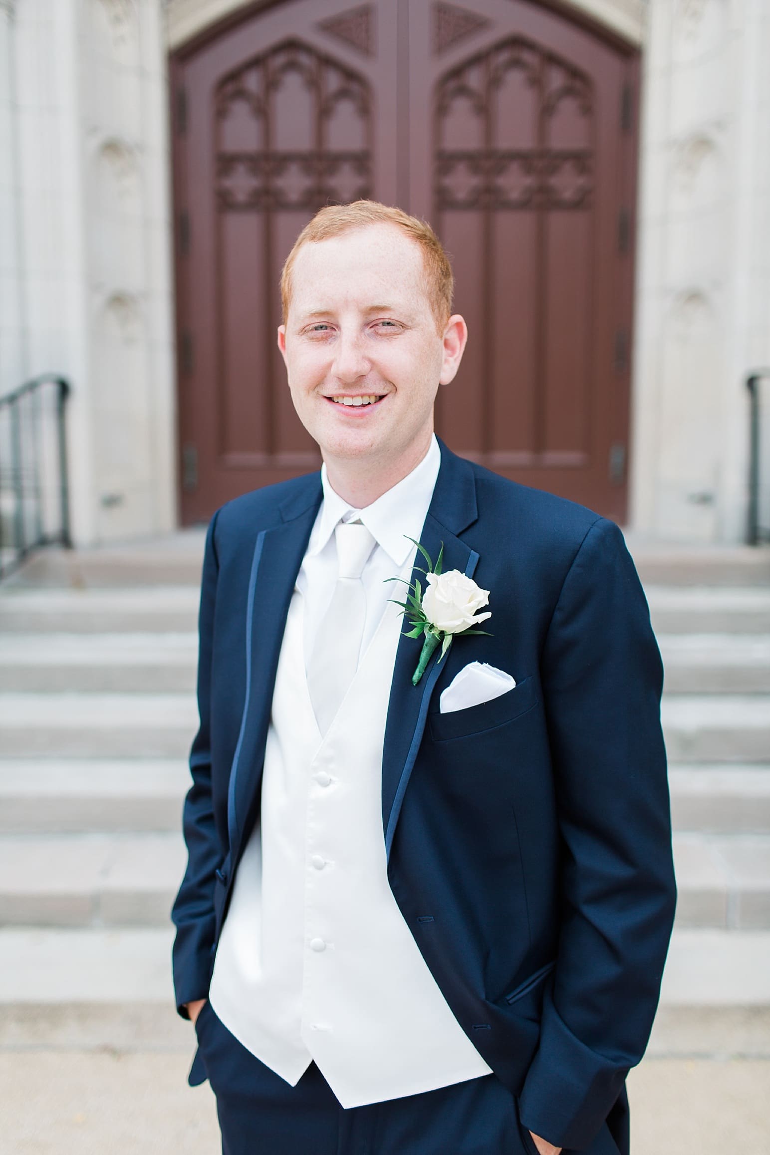 Arielle Peters Photography | Groom outside large cathedral church on wedding day at First United Methodist Church in Mishawaka, Indiana.