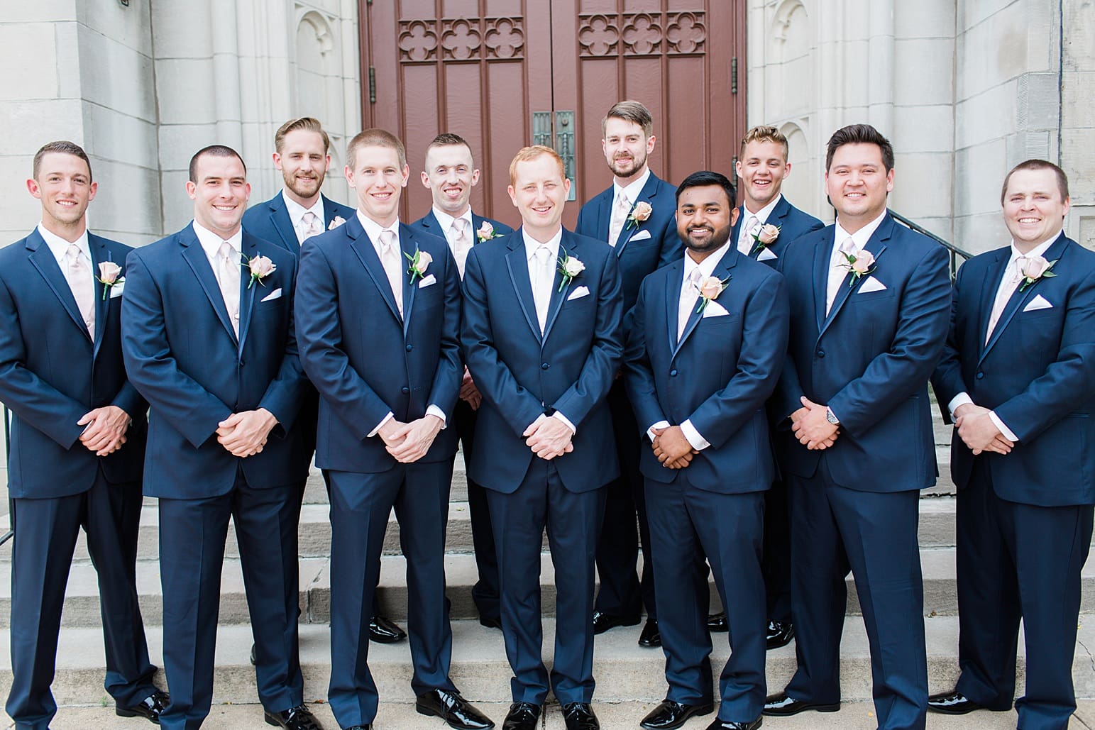 Arielle Peters Photography | Groom and groomsmen outside large cathedral church on wedding day at First United Methodist Church in Mishawaka, Indiana.