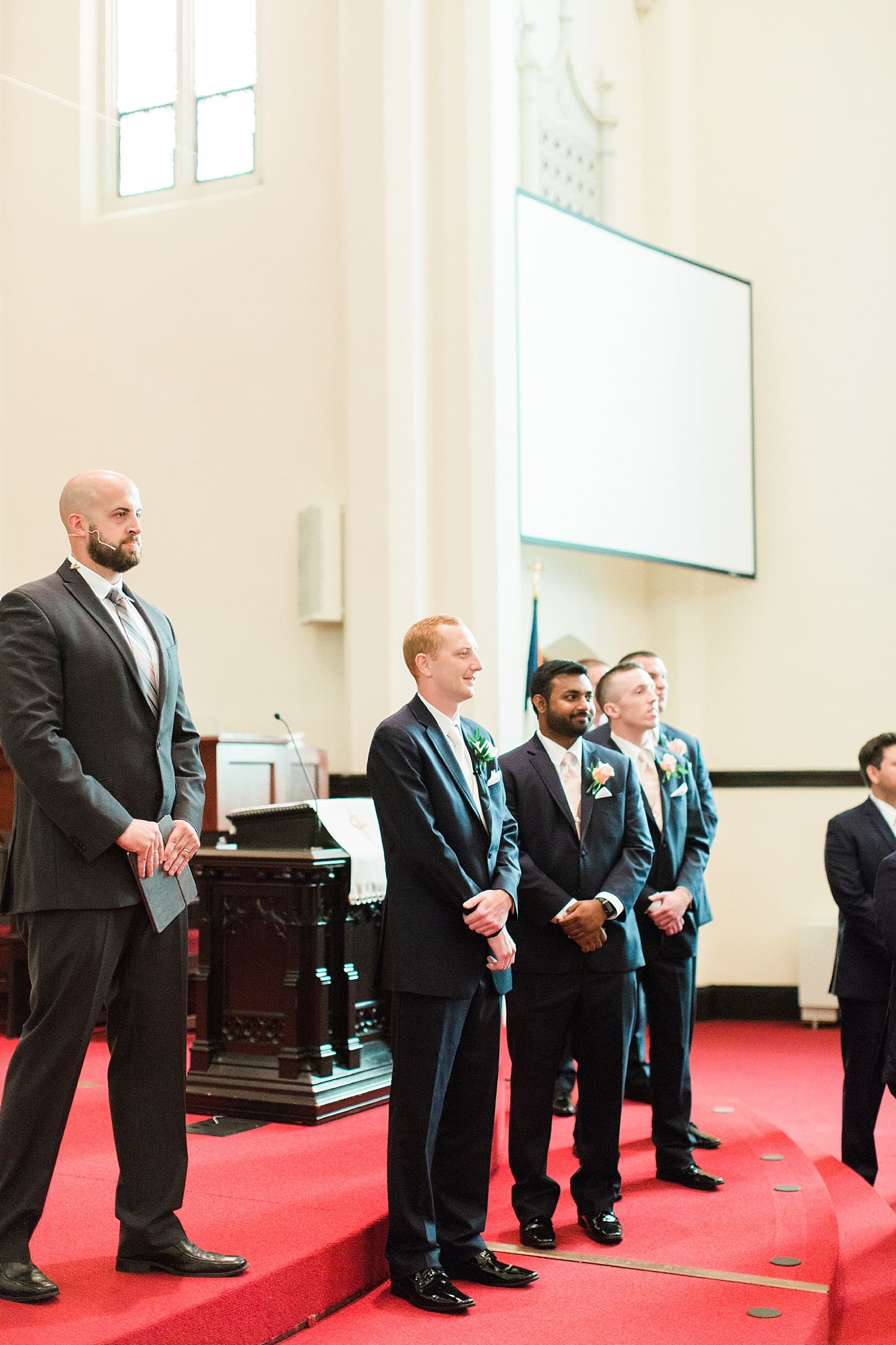 Arielle Peters Photography | Groom and groomsmen at front of cathedral church on wedding day at First United Methodist Church in Mishawaka, Indiana.