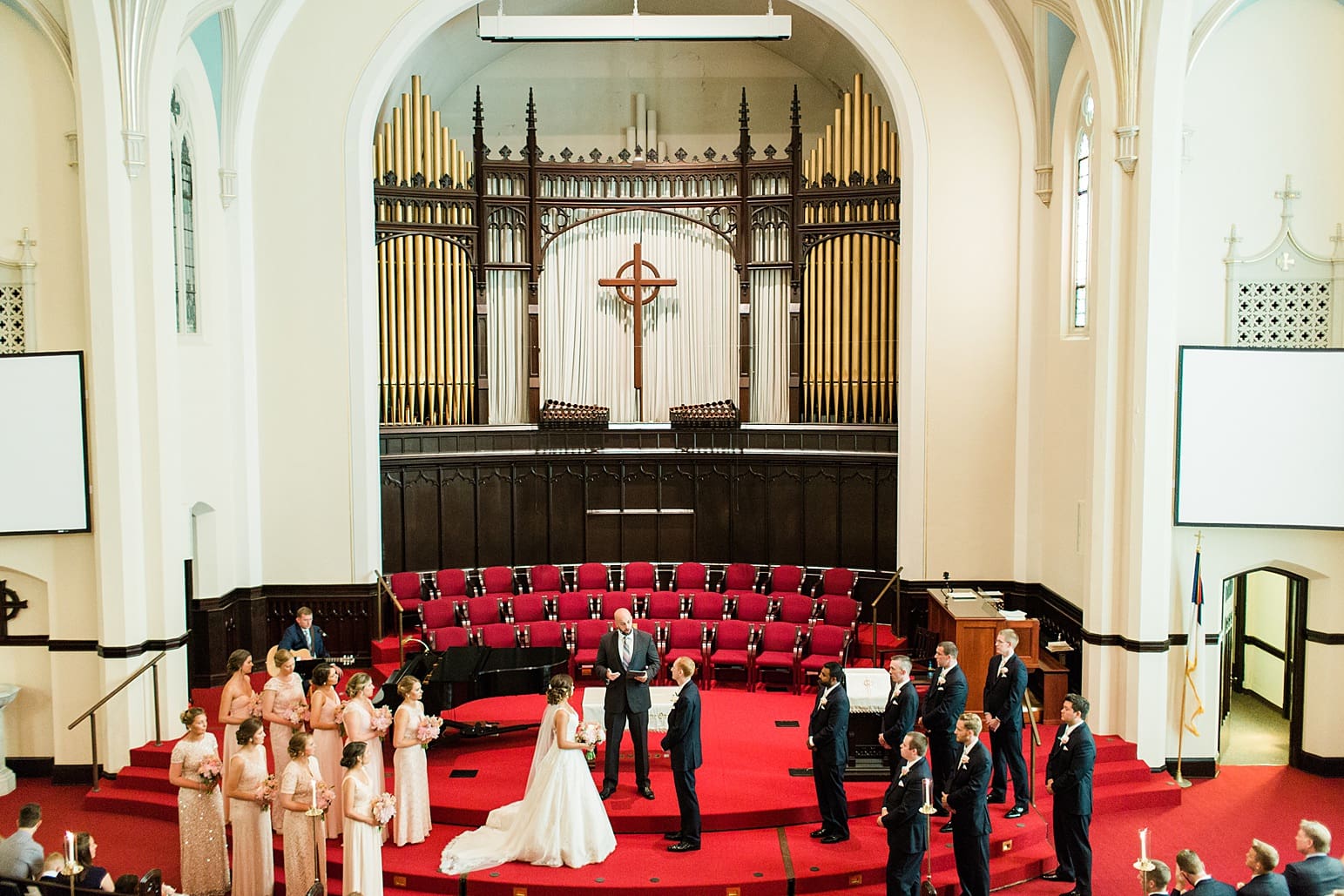Arielle Peters Photography | Bride and groom at the alter on wedding day at First United Methodist Church in Mishawaka, Indiana.
