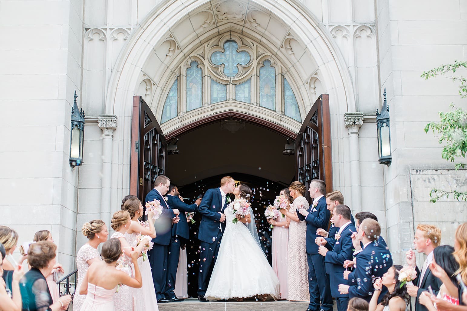 Arielle Peters Photography | Bride and groom kissing outside cathedral on wedding day at First United Methodist Church in Mishawaka, Indiana.