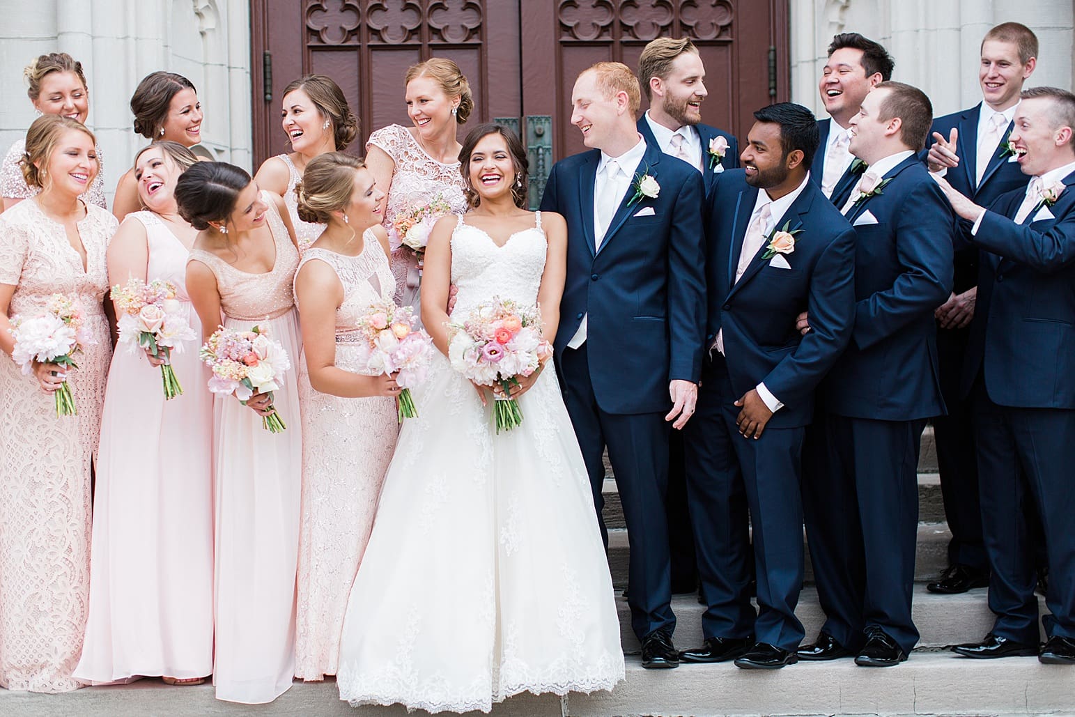 Arielle Peters Photography | Wedding party standing on cathedral church steps on wedding day at First United Methodist Church in Mishawaka, Indiana.