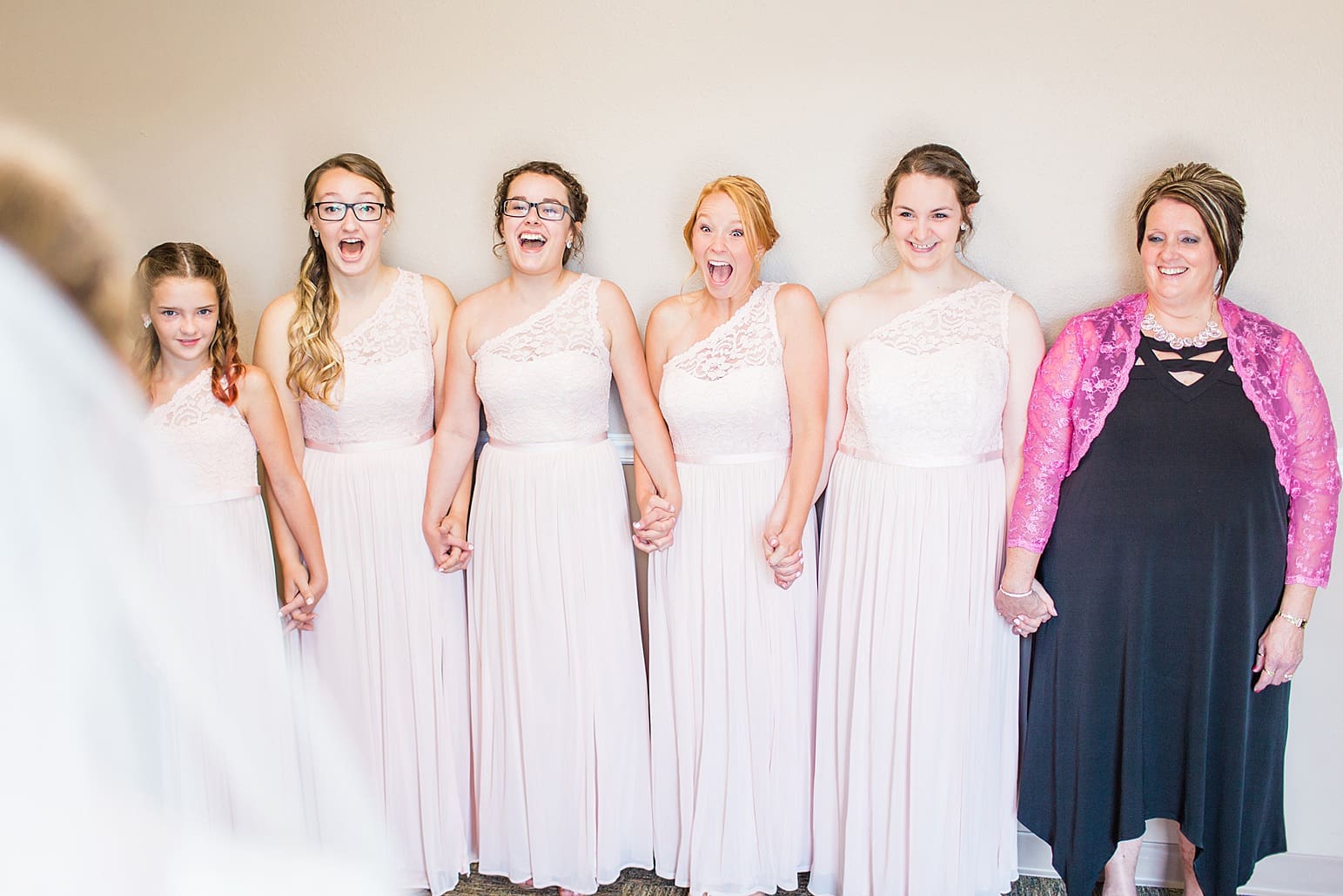 Arielle Peters Photography | Bride and bridesmaids having first reveal on wedding day at St. Joseph County Parks in South Bend, Indiana.