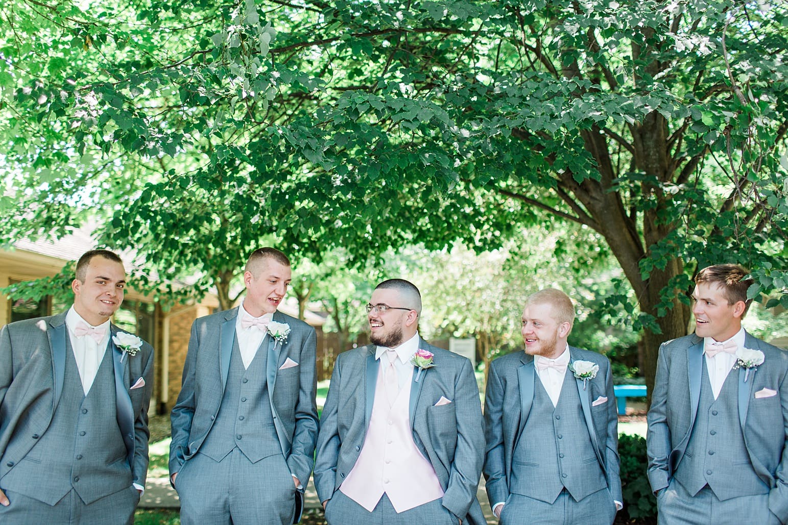 Arielle Peters Photography | Groom and groomsmen outside under trees on wedding day at St. Joseph County Parks in South Bend, Indiana.