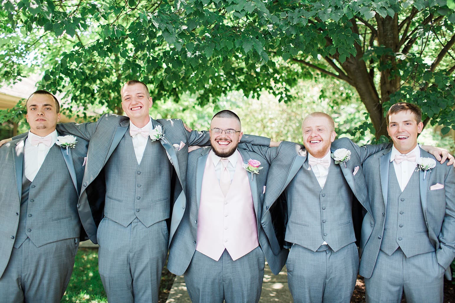 Arielle Peters Photography | Groom and groomsmen outside under trees on wedding day at St. Joseph County Parks in South Bend, Indiana.