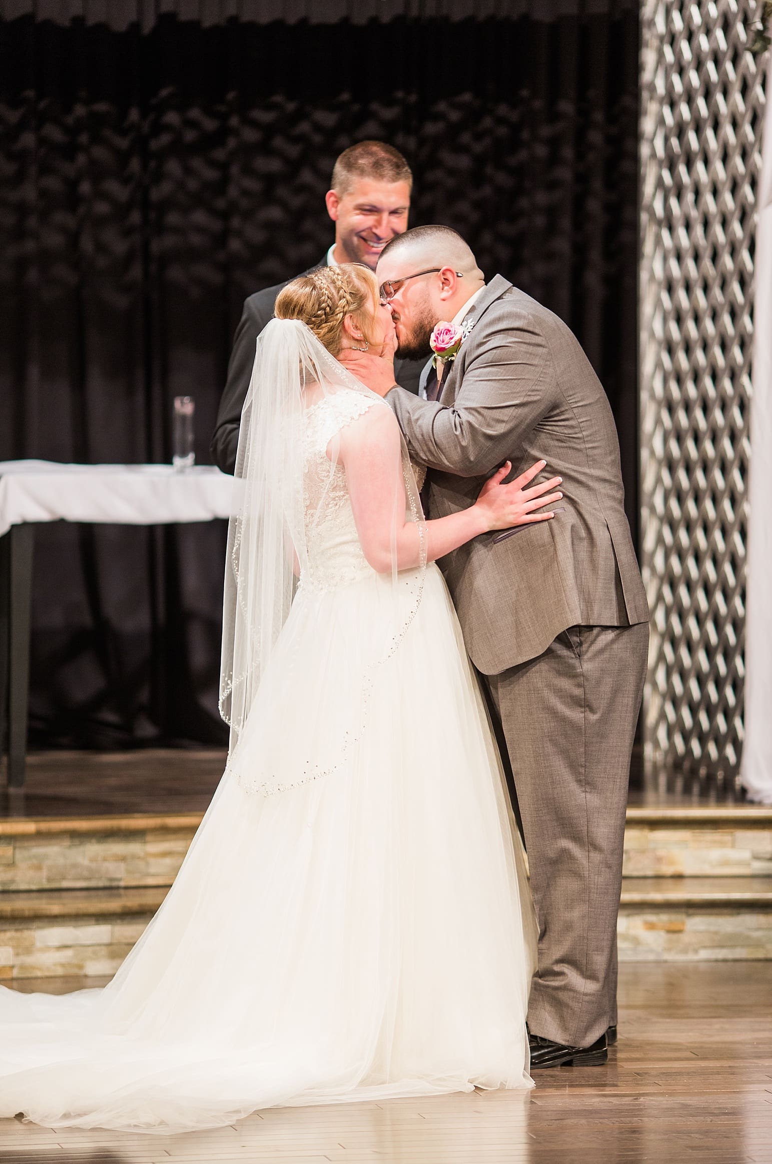 Arielle Peters Photography | Bride and groom kissing at alter on wedding day at St. Joseph County Parks in South Bend, Indiana.