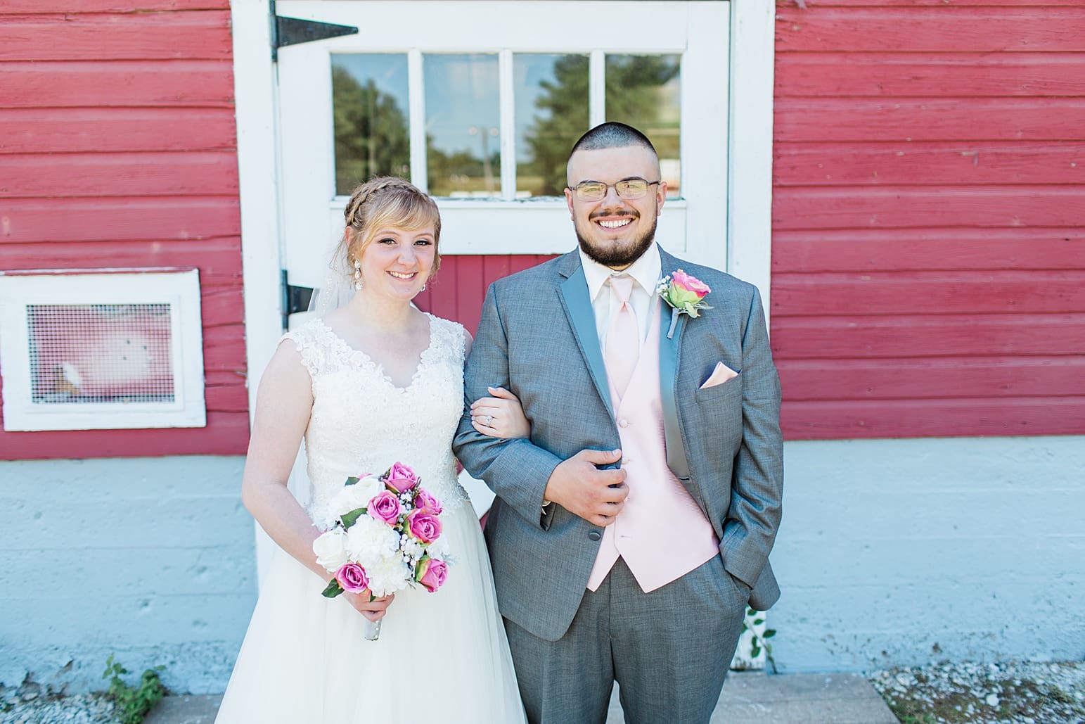 Arielle Peters Photography | Bride and groom next to old red barn on wedding day at St. Joseph County Parks in South Bend, Indiana.