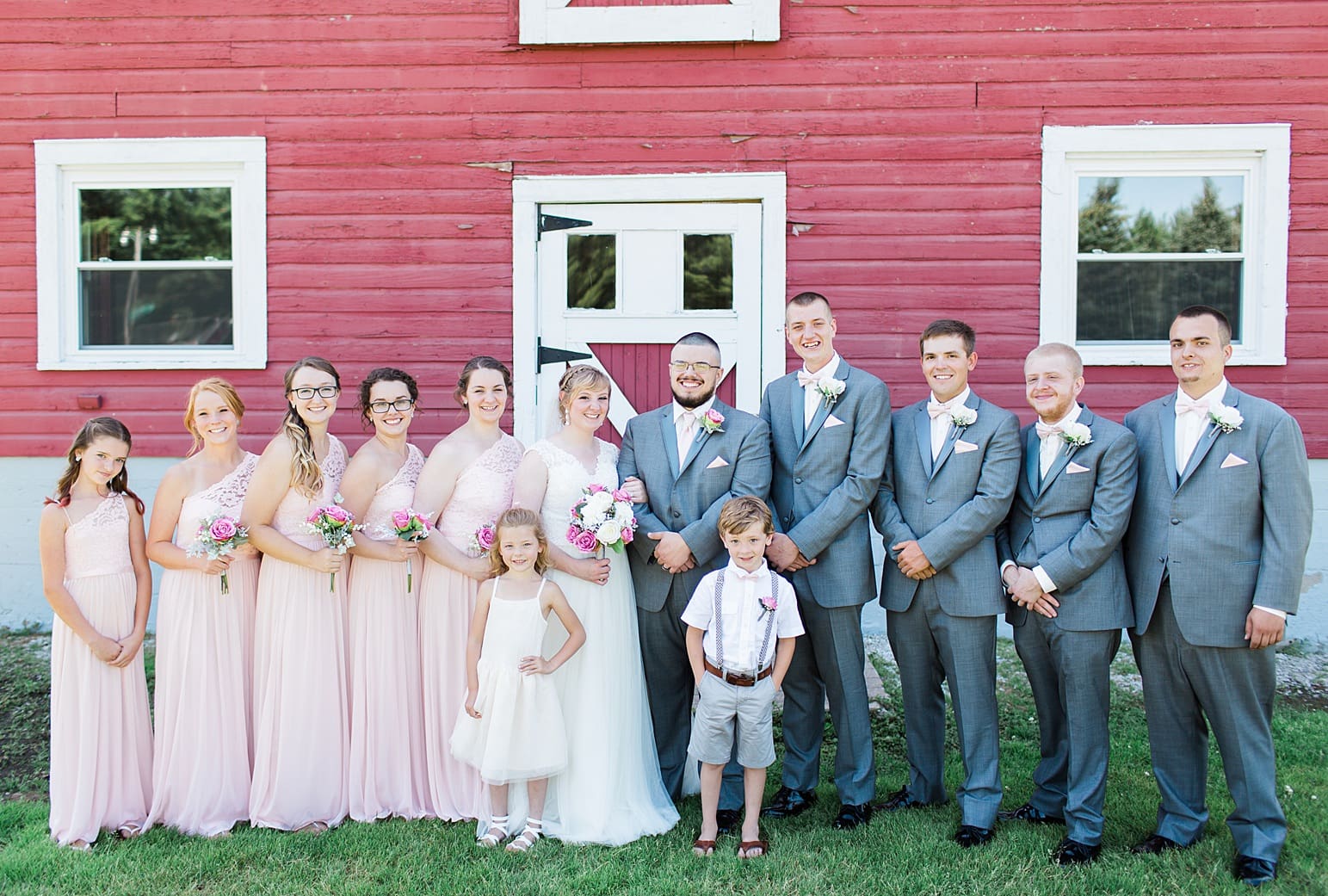 Arielle Peters Photography | Wedding party next to old red barn on wedding day at St. Joseph County Parks in South Bend, Indiana.